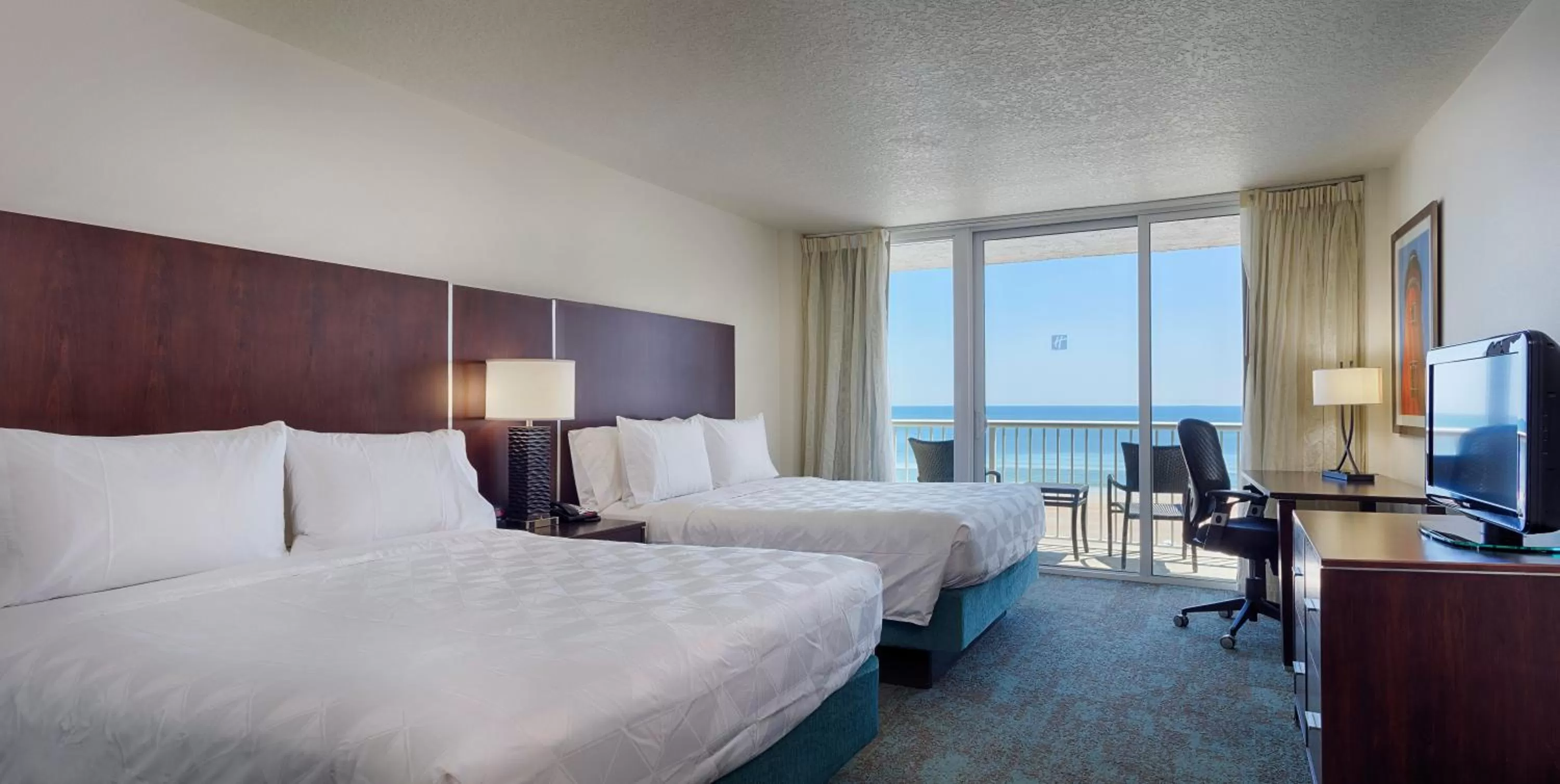 Photo of the whole room, Bed in Holiday Inn Resort Daytona Beach Oceanfront by IHG