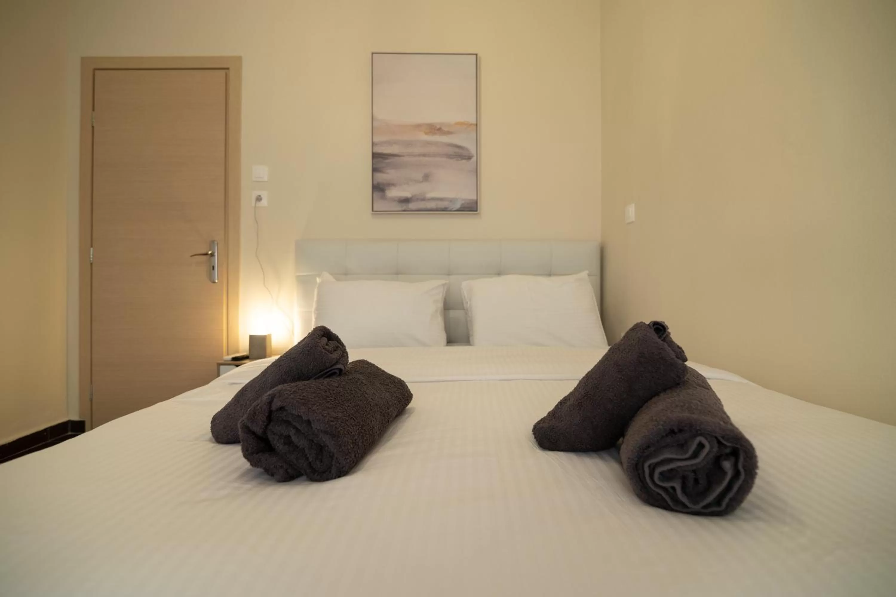 Bed in Votsalakia Hotel & Luxury Apartments