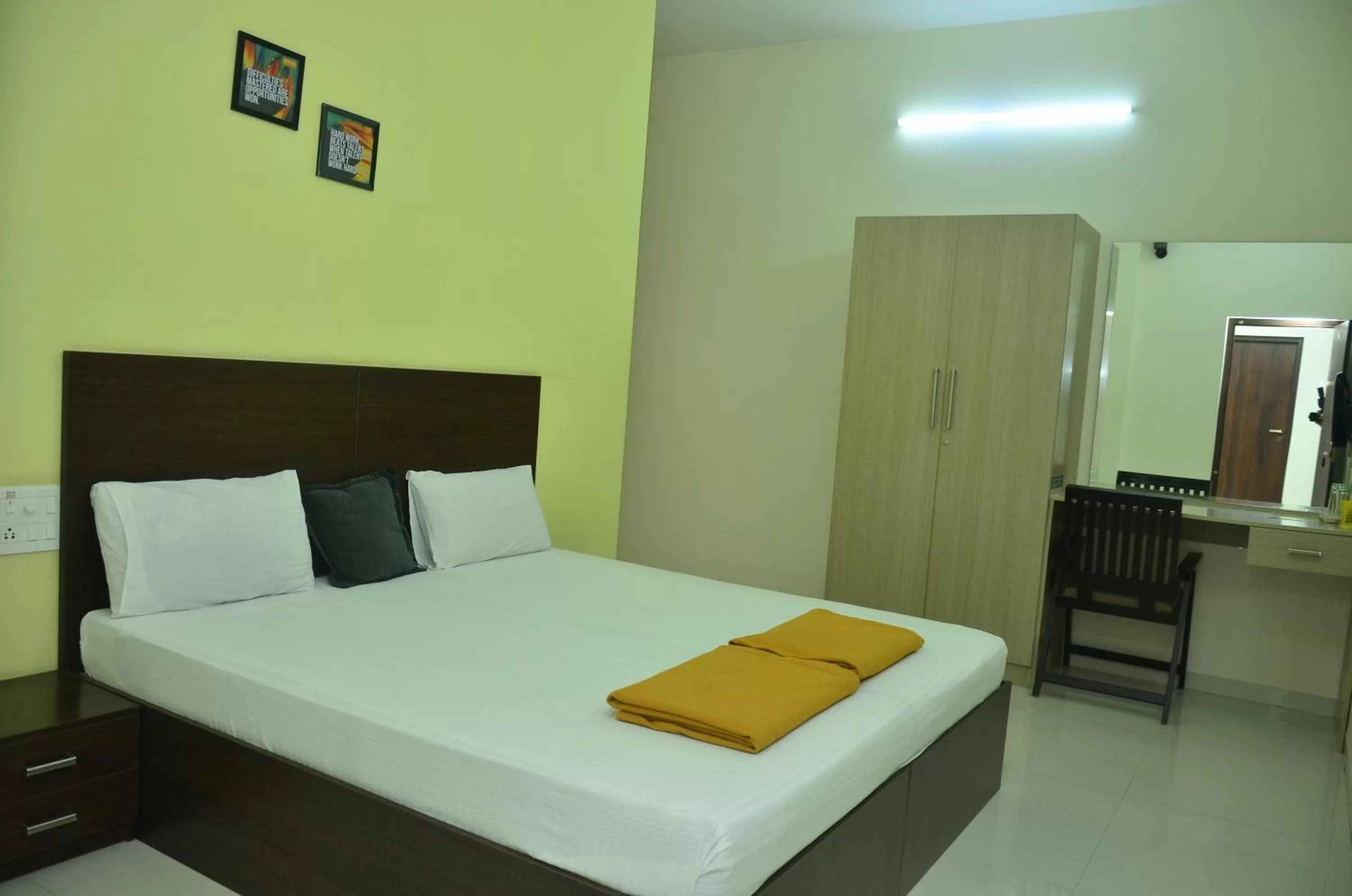 Bed in THE SURRYA MAX RESIDENCY