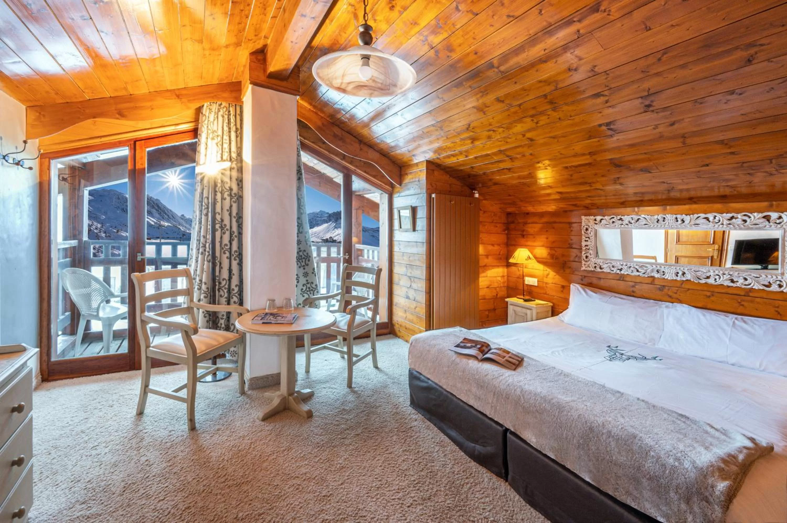 Photo of the whole room, Bed in Hôtel les Campanules by Les Etincelles