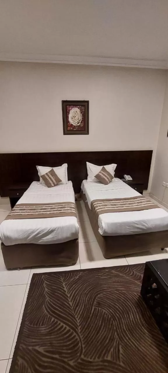 Bed in Shams Suites Furnished Units