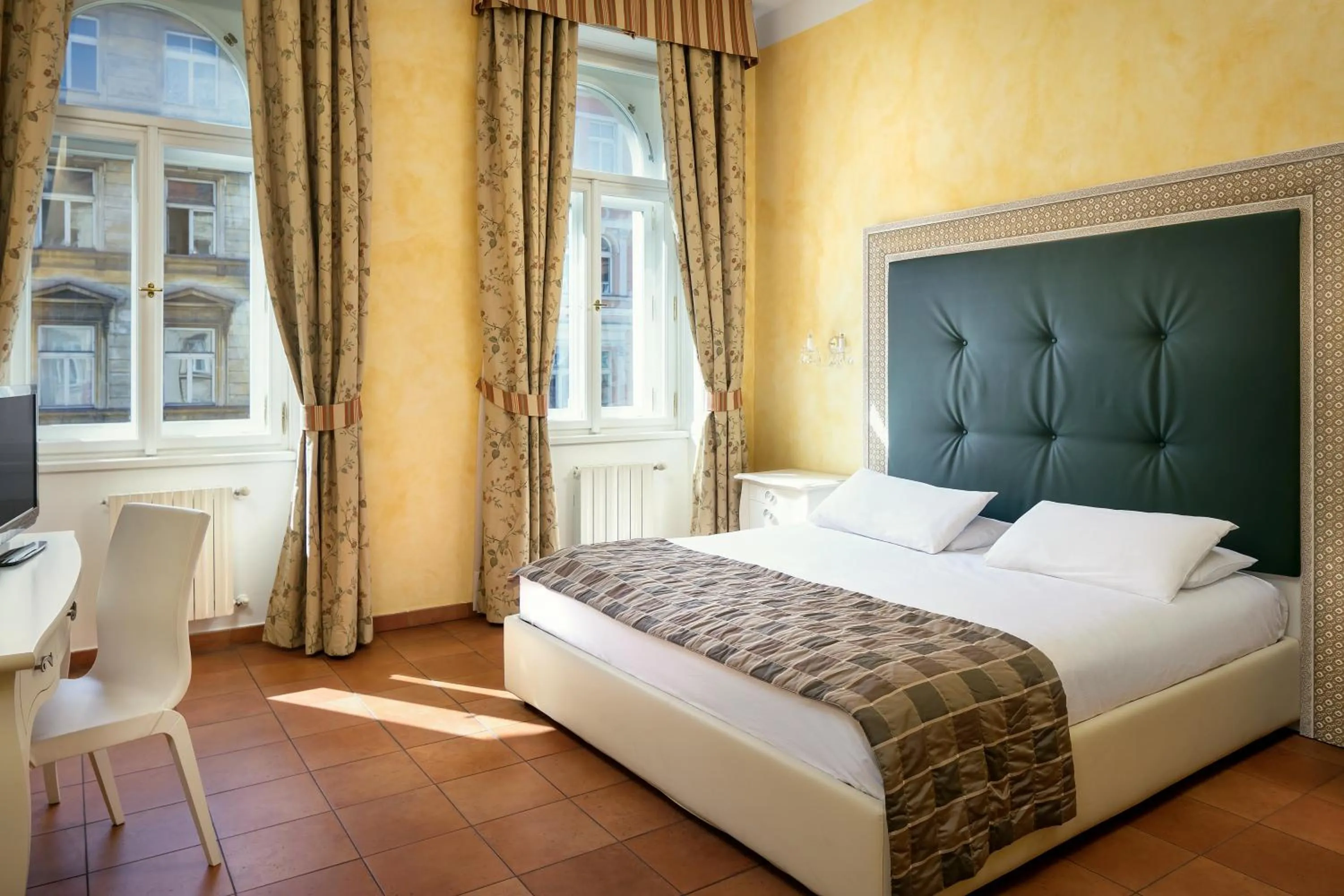 Bed in Hotel Caesar Prague