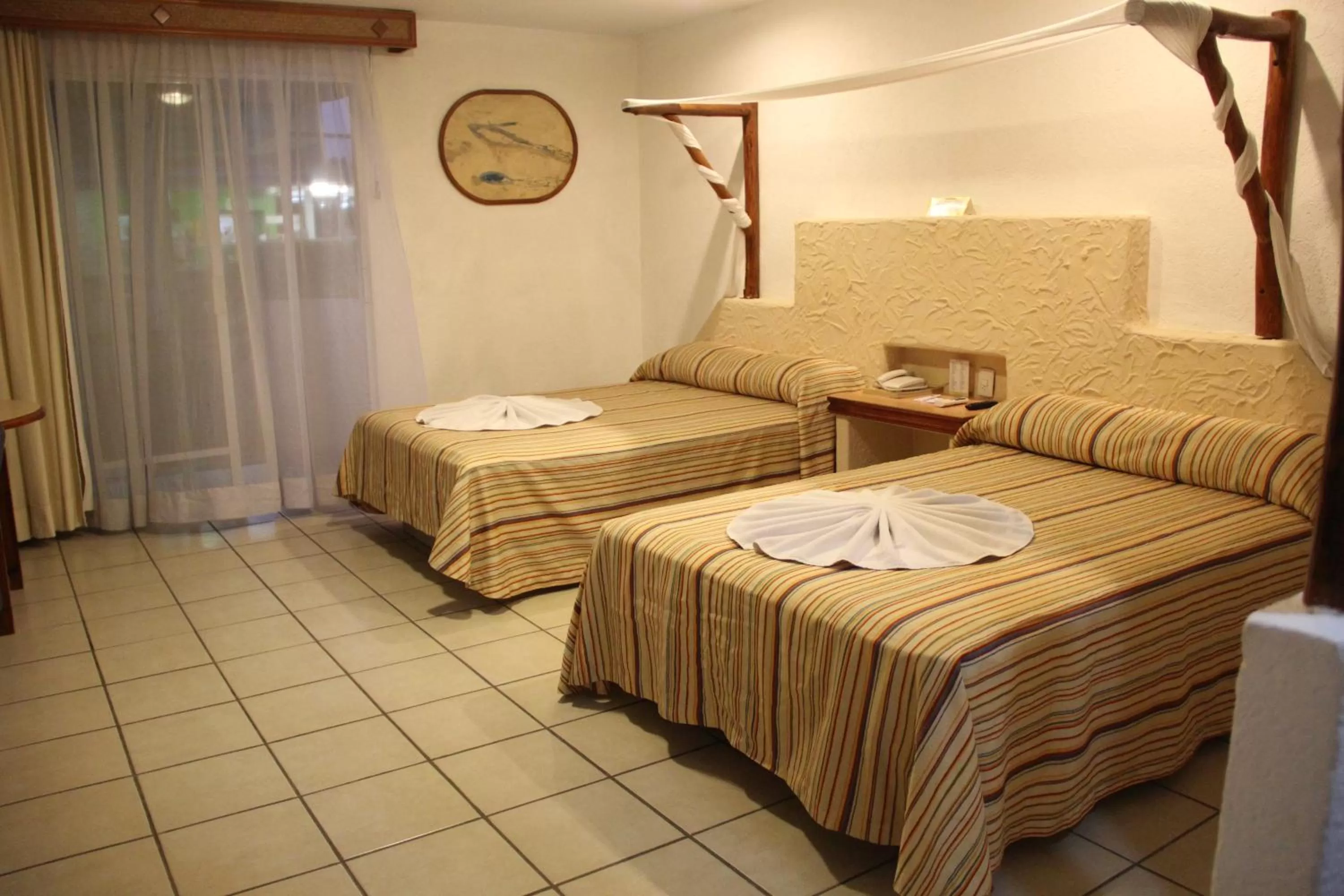 Bed in Hotel Palapa Palace