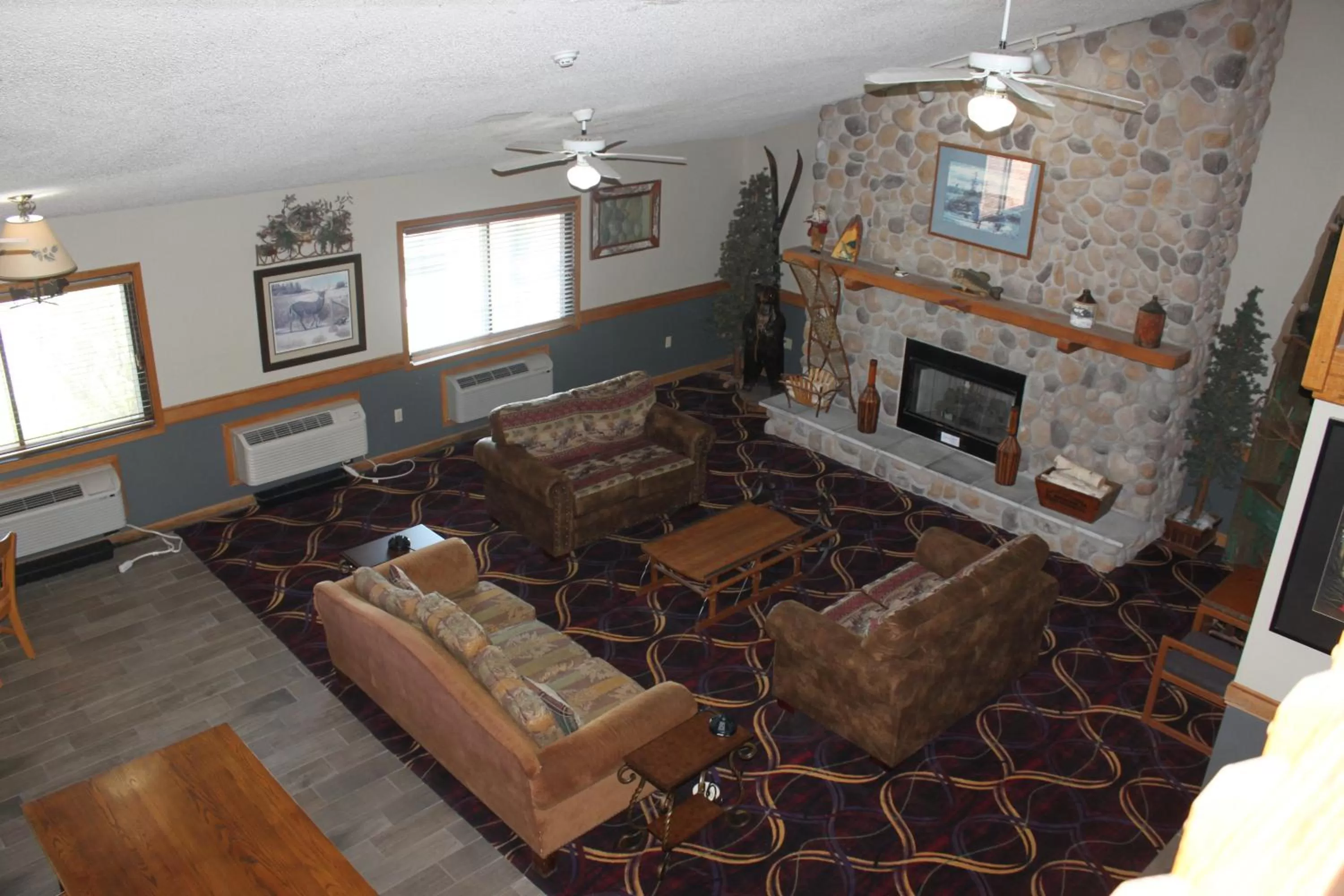 Living room in AmericInn by Wyndham West Burlington