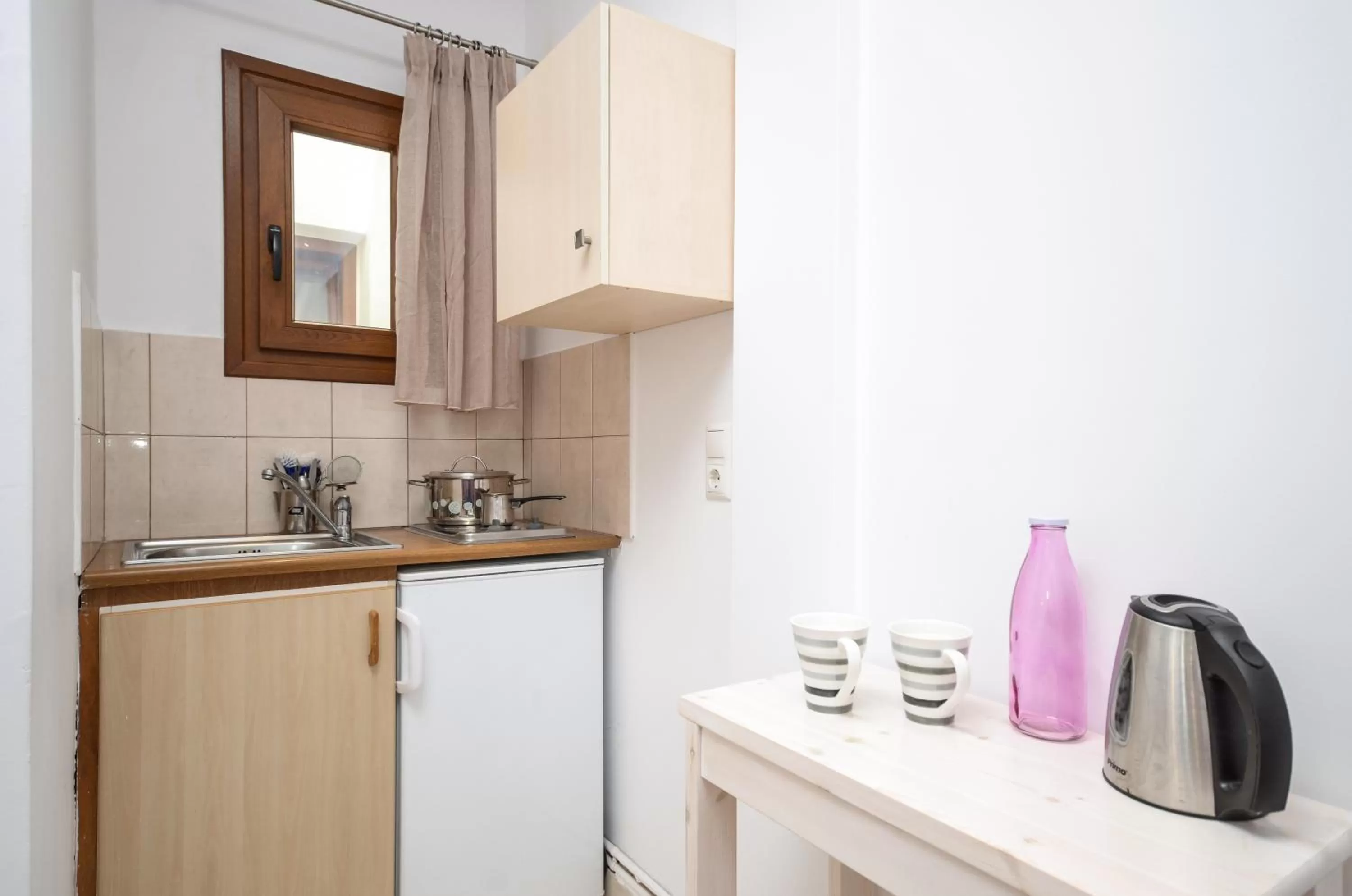 Kitchen or kitchenette in Panormos Hotel and Studios