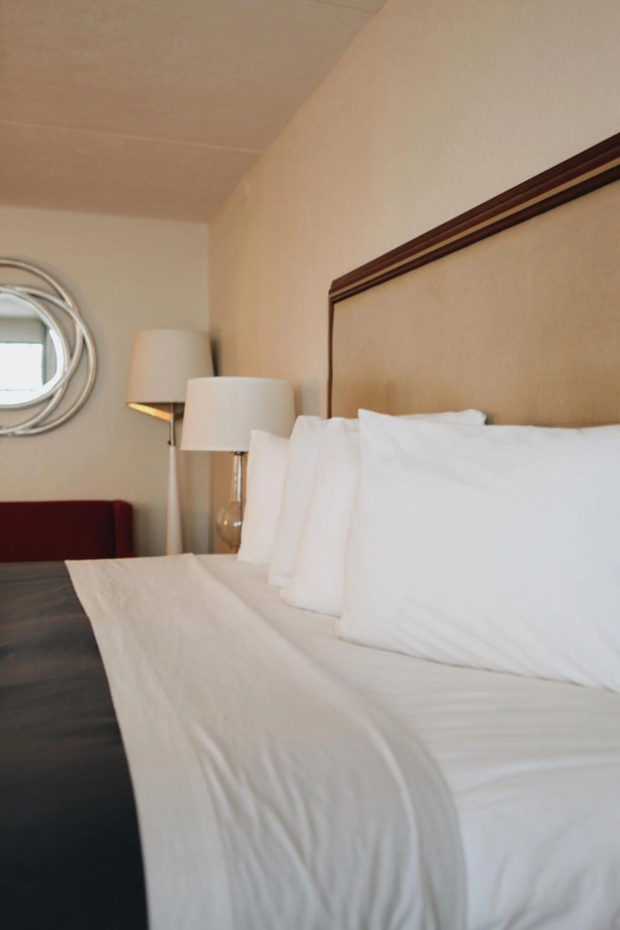 Bed in All Seasons Inn & Suites