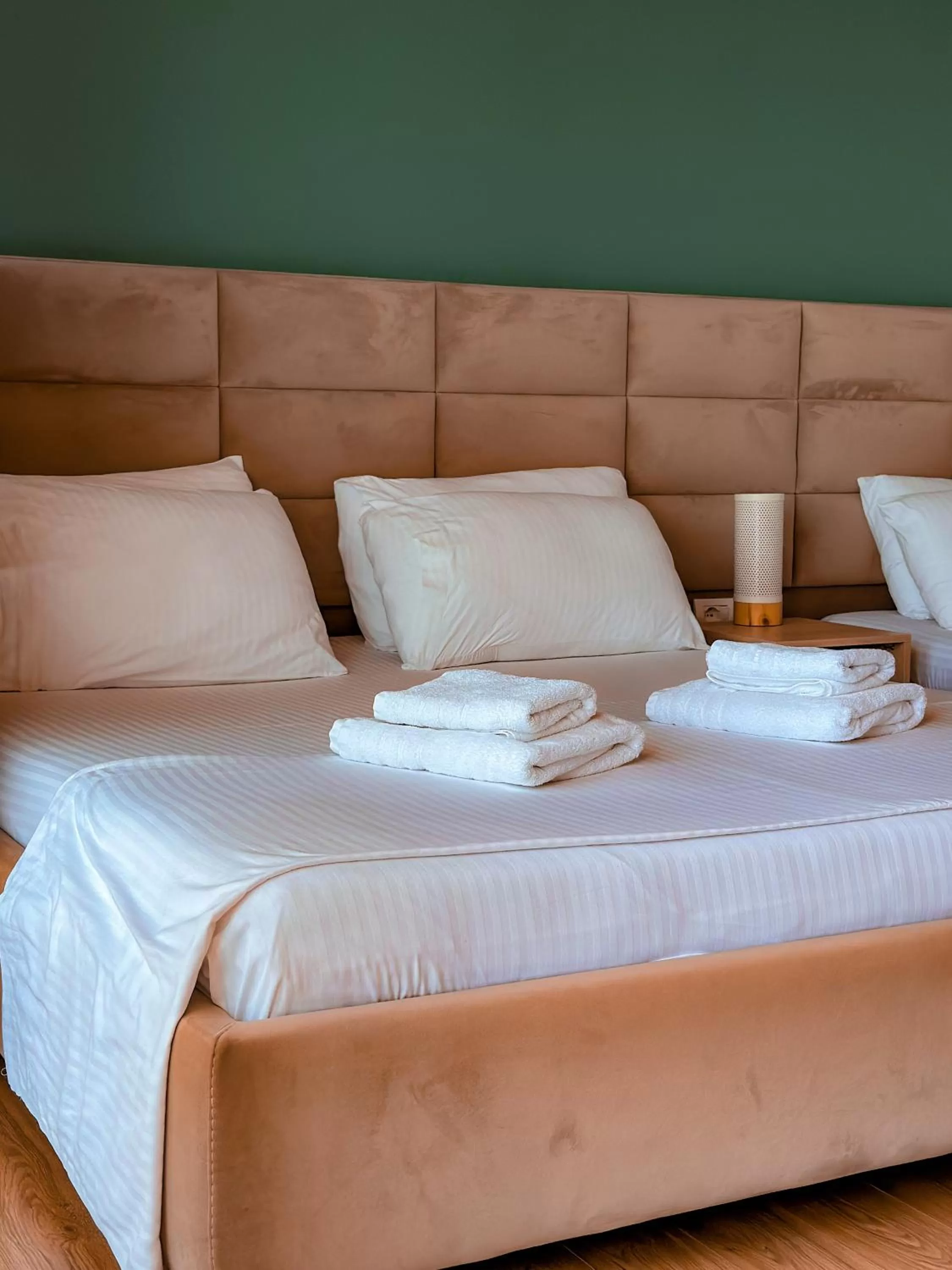 Bed in Aphrodite Garden Rooms & Apartment