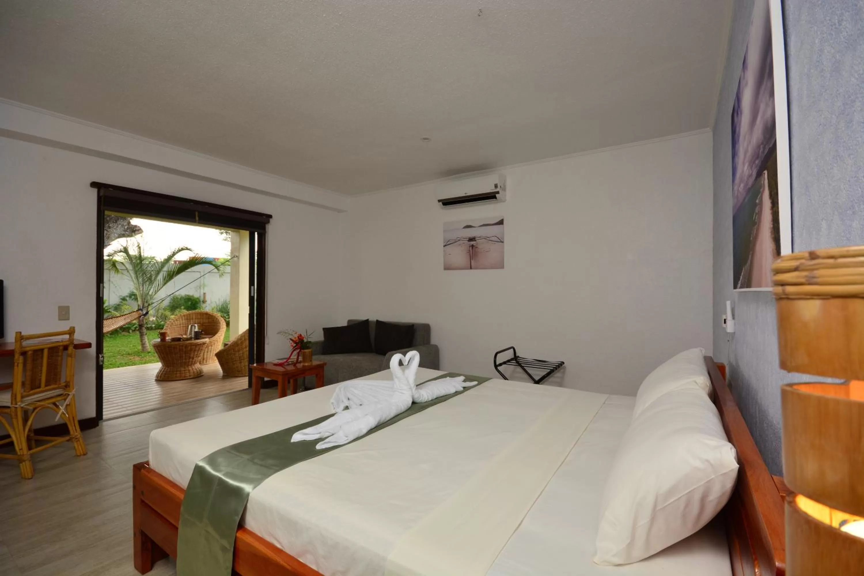 Photo of the whole room, Bed in Munting Paraiso