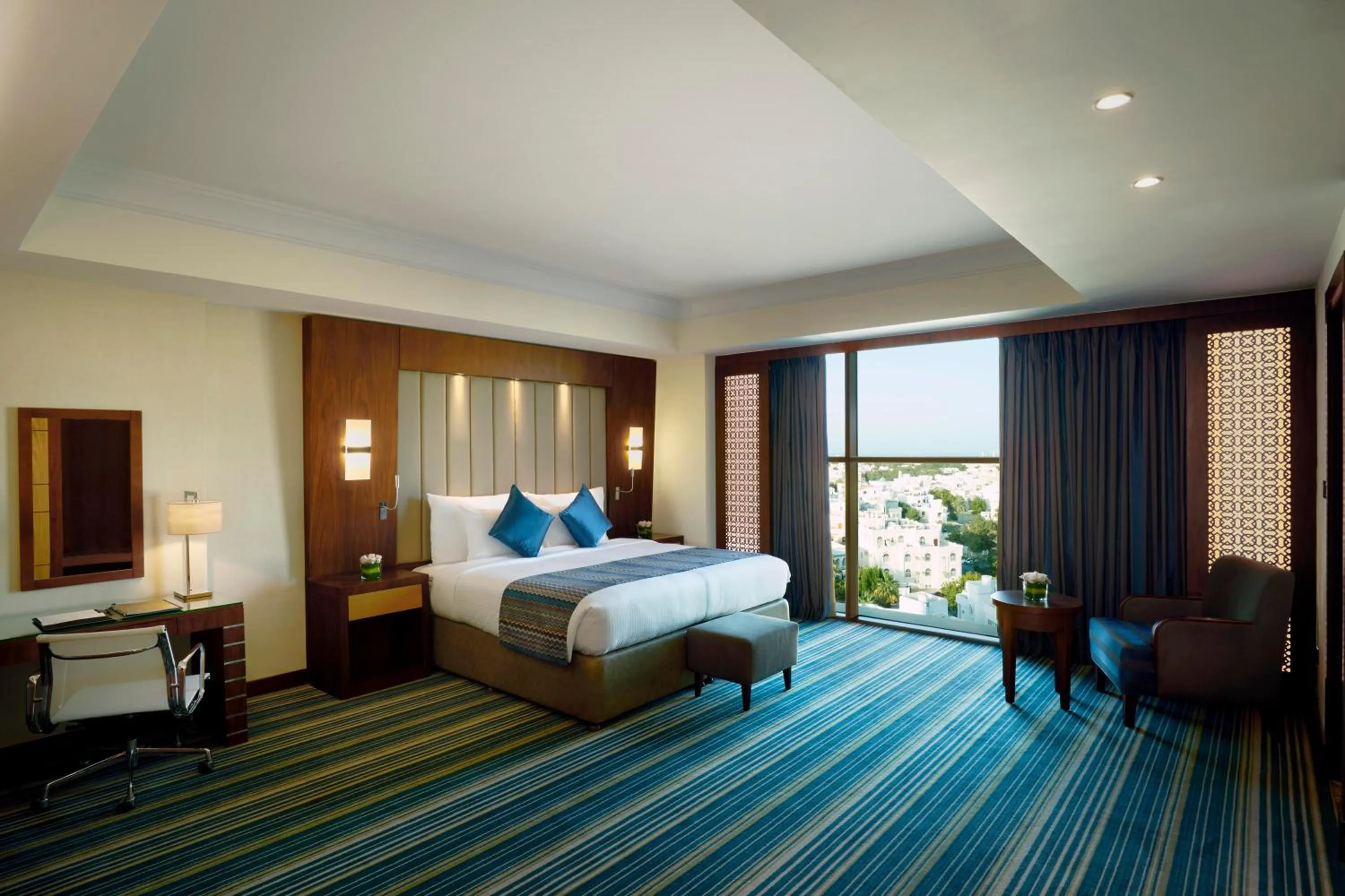 Photo of the whole room, Bed in Royal Tulip Muscat