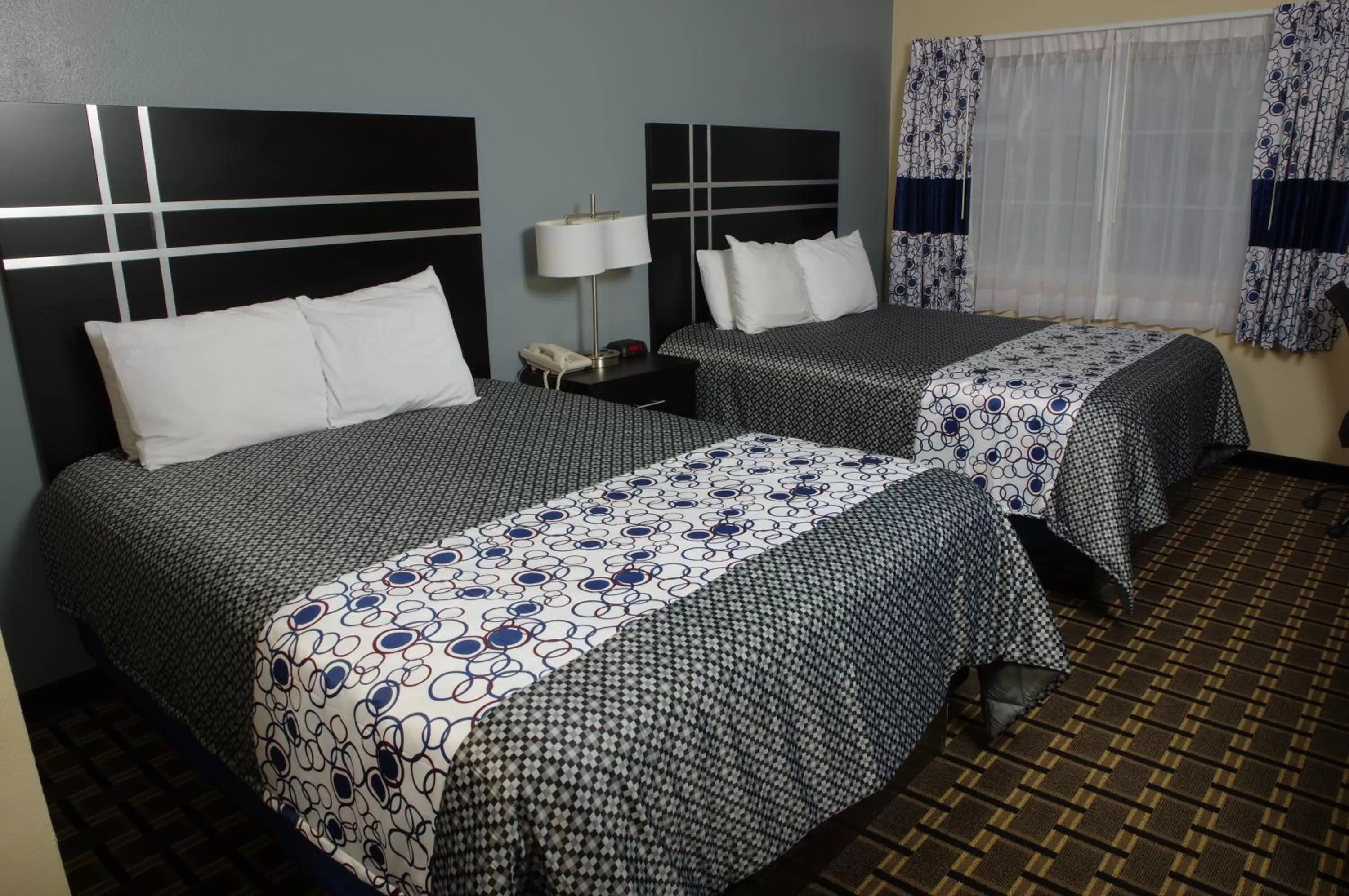 Bed in DUTCH INN AND SUITES