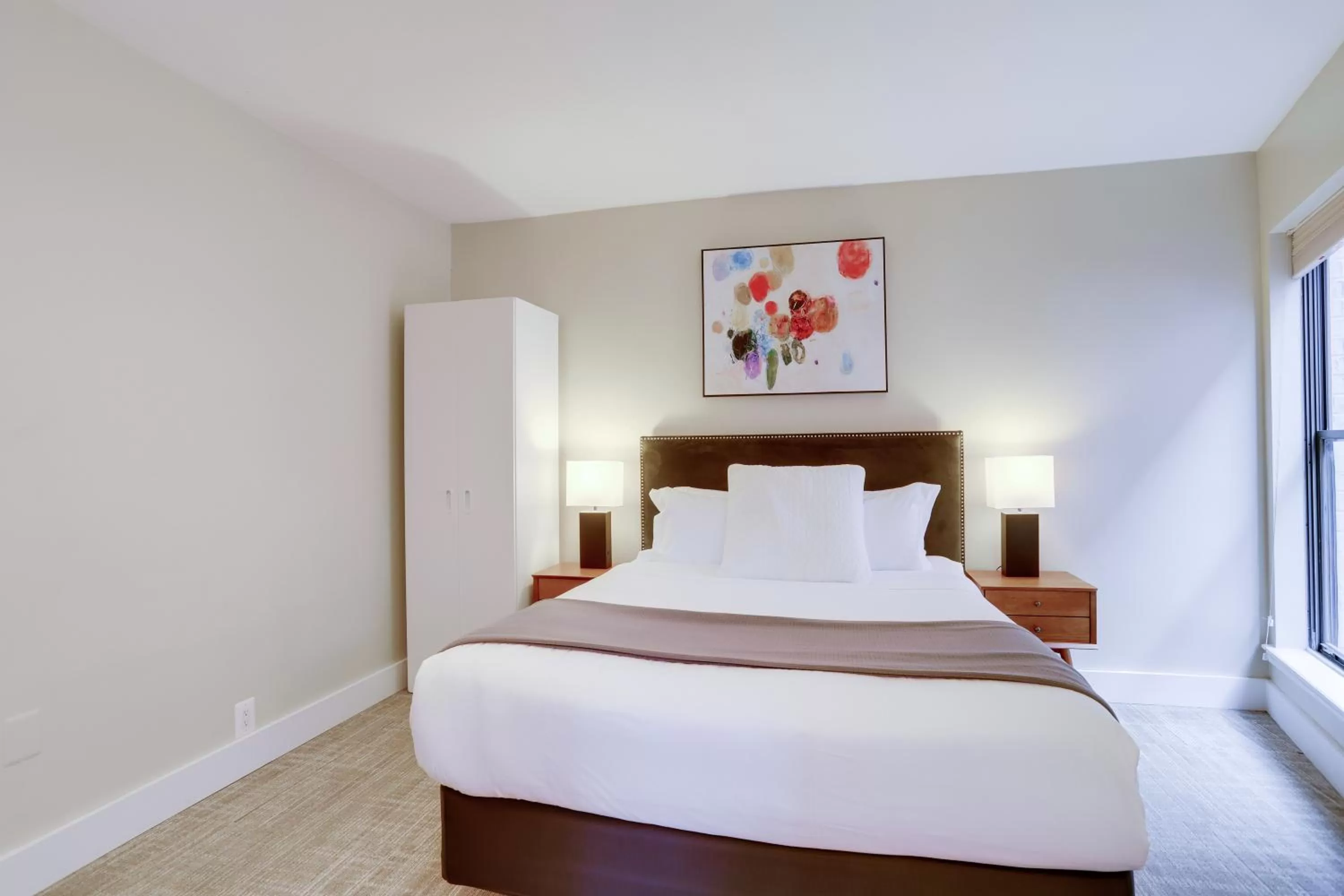 Bed in Sojourn at DuPont Place