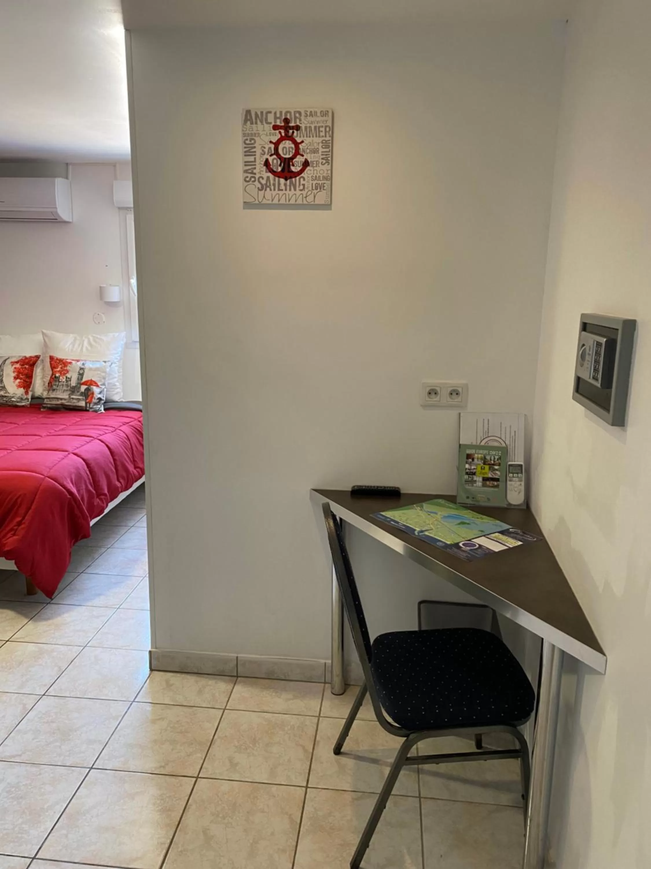 Bed in LOGIS Hôtel La Chaumière