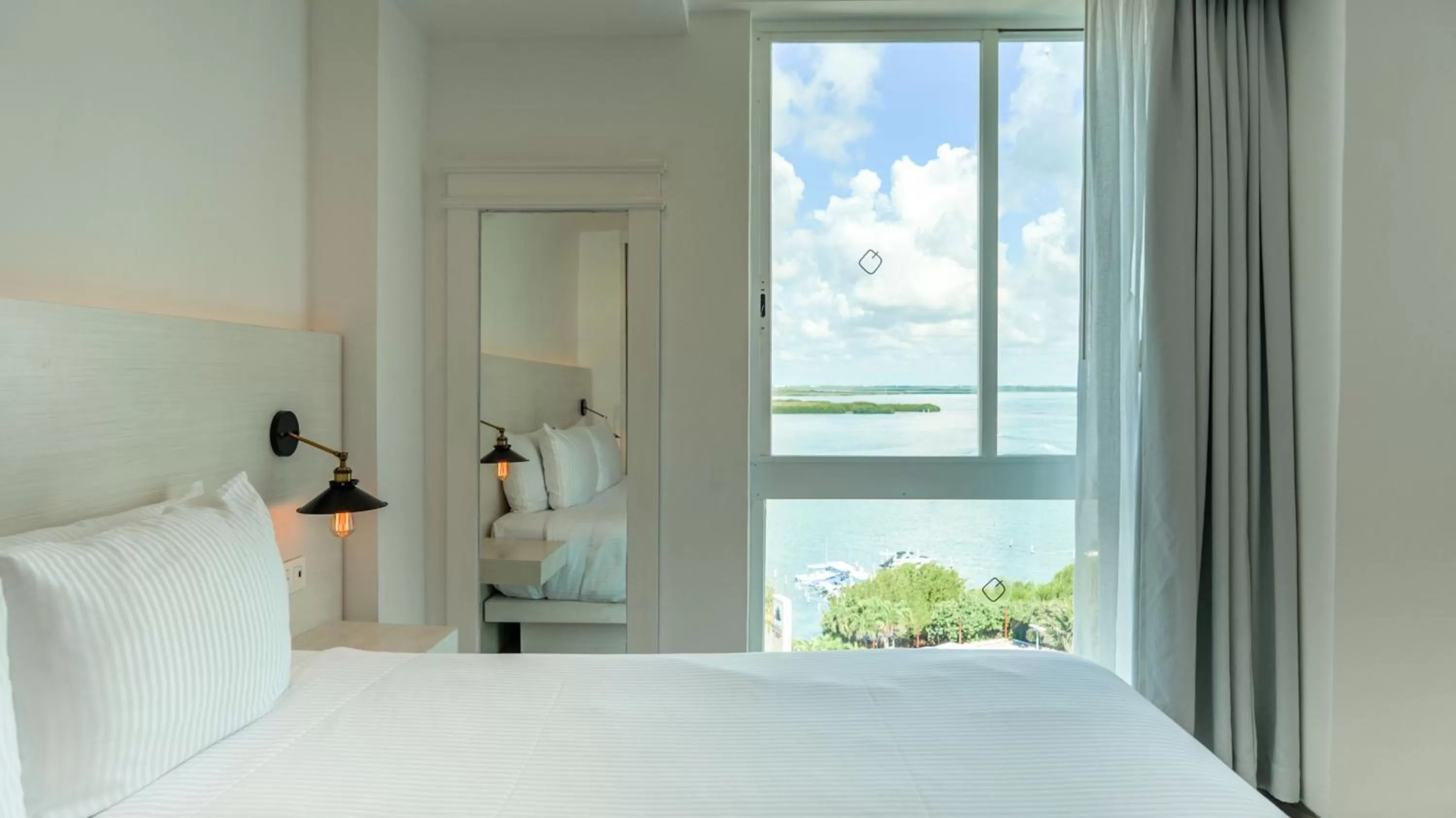 Photo of the whole room, Bed in Oleo Cancun Playa All Inclusive Resort