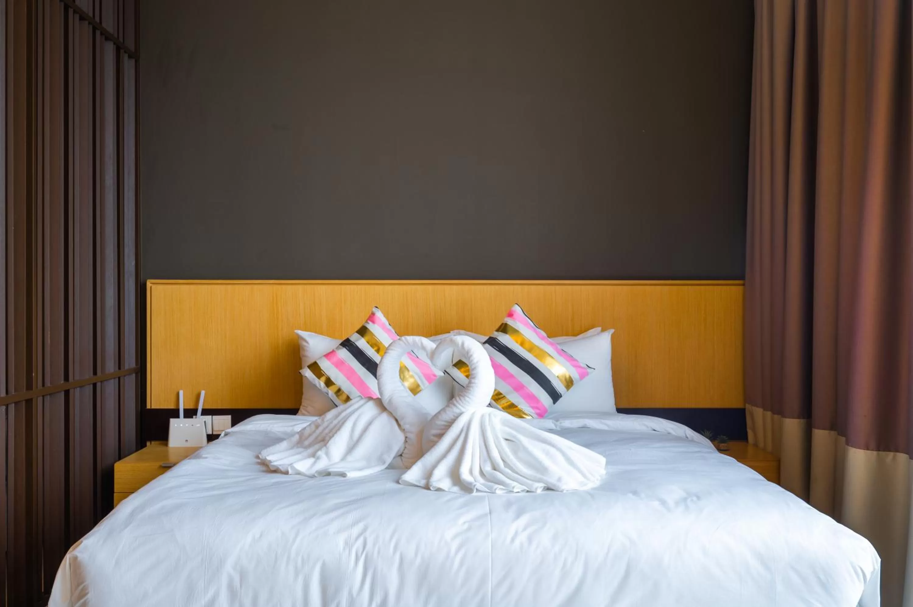 Bed in Greystone 99 Suites