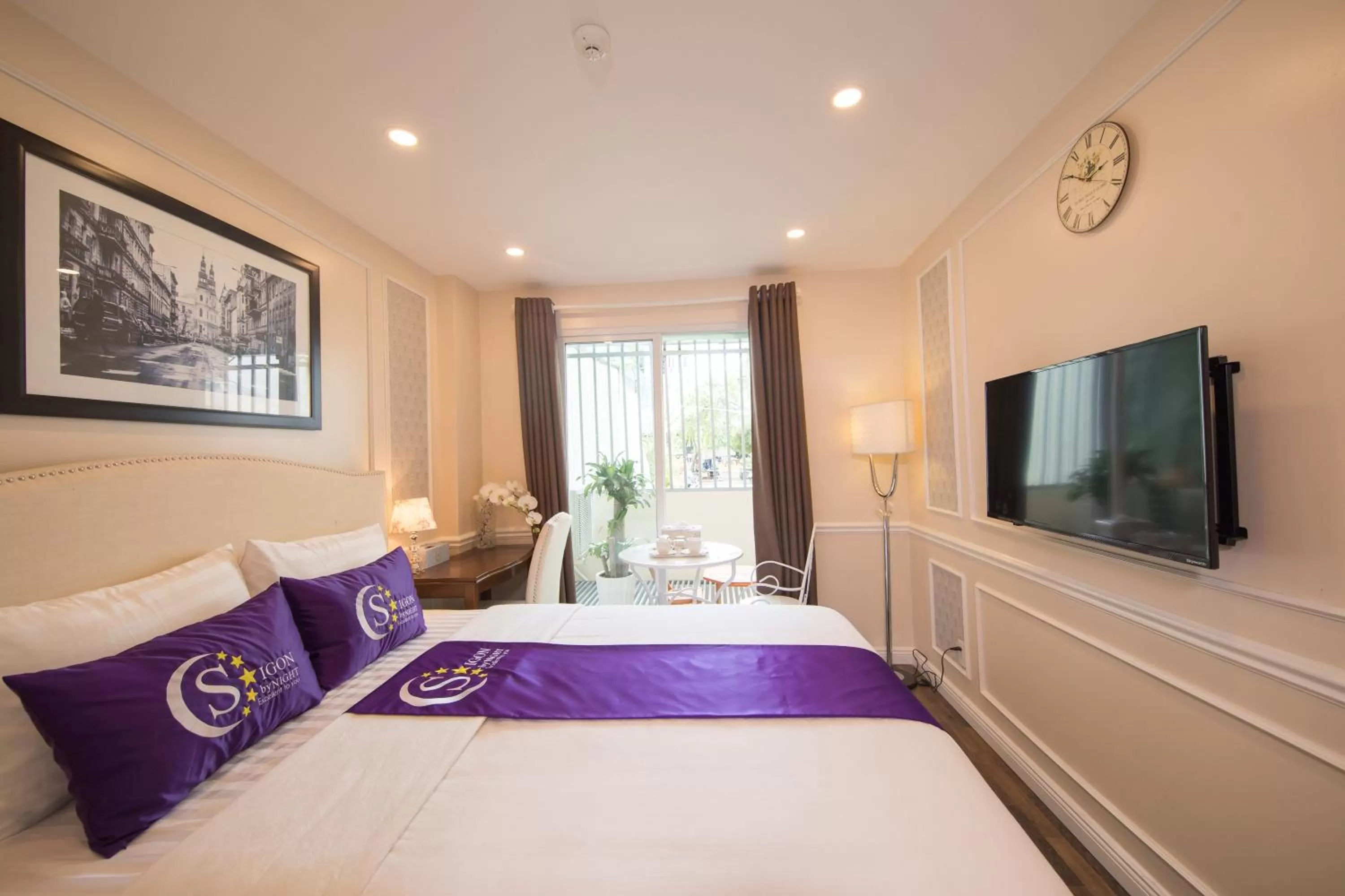 Bed in Saigon By Night Luxury Hotel