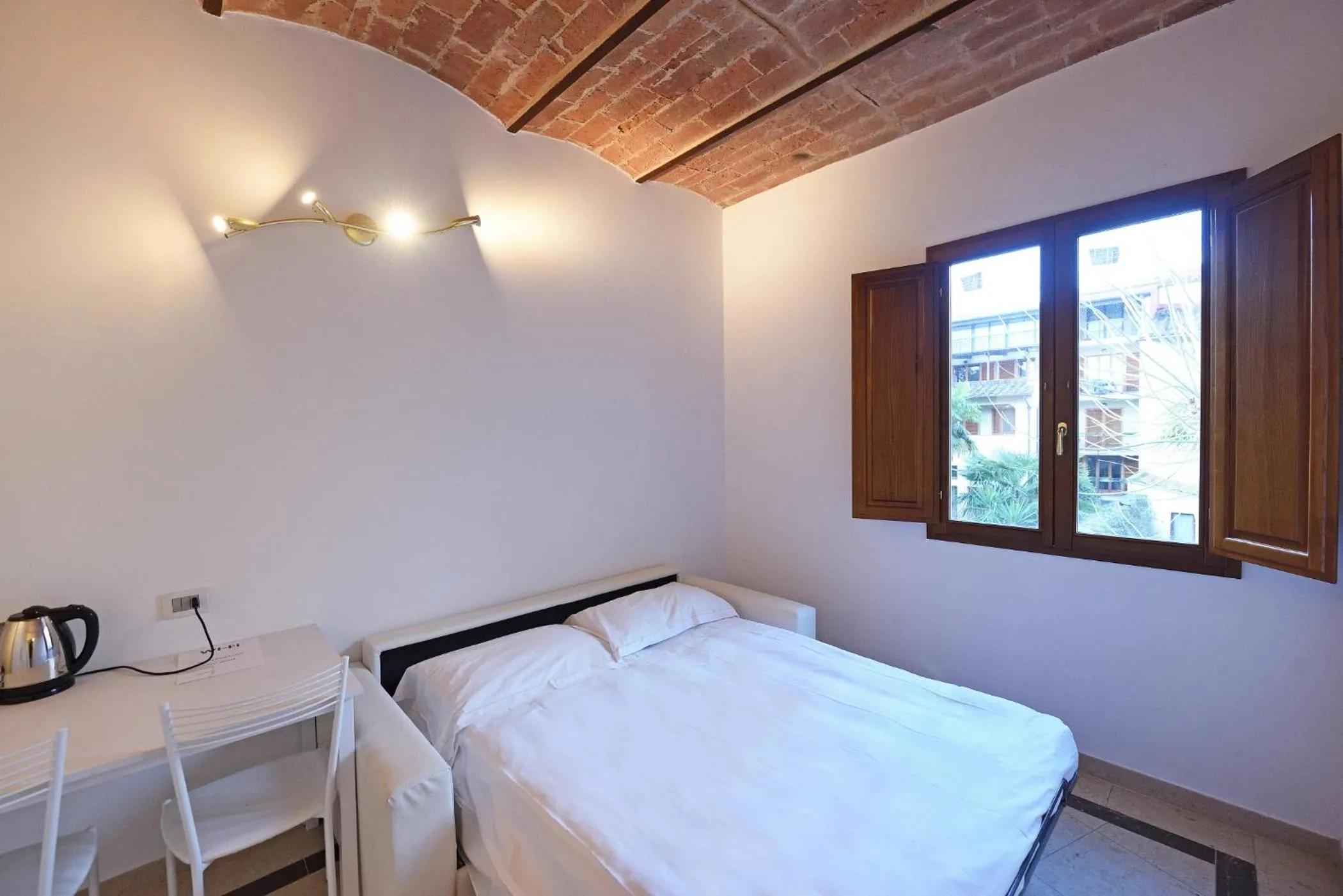 Kitchen or kitchenette, Bed in Relais La Corte di Cloris