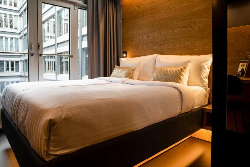 Photo of the whole room, Bed in GINN Hotel Hamburg Elbspeicher