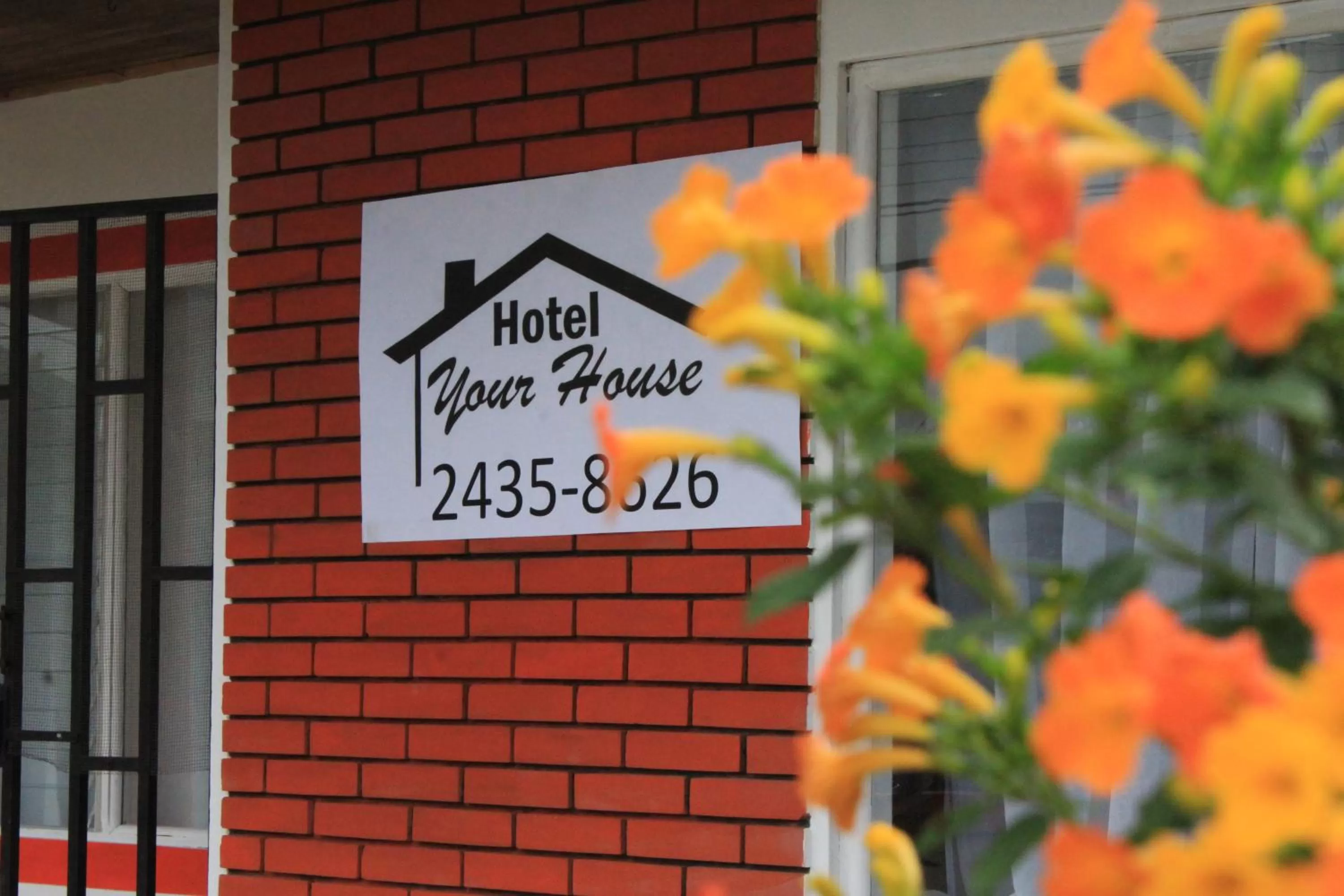 Property logo or sign in Hotel Your House