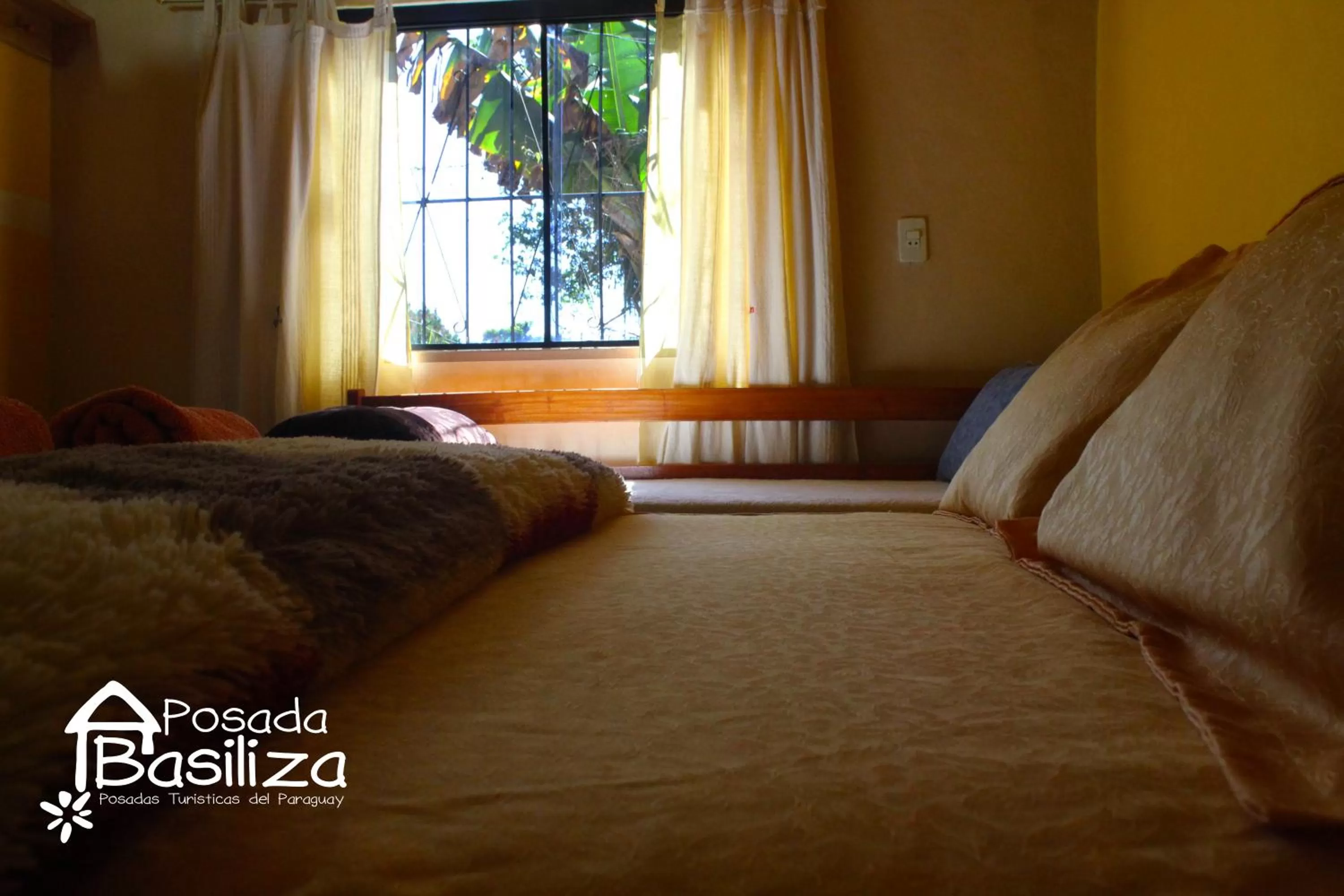 Photo of the whole room, Bed in Posada Basiliza, Encarnación PY