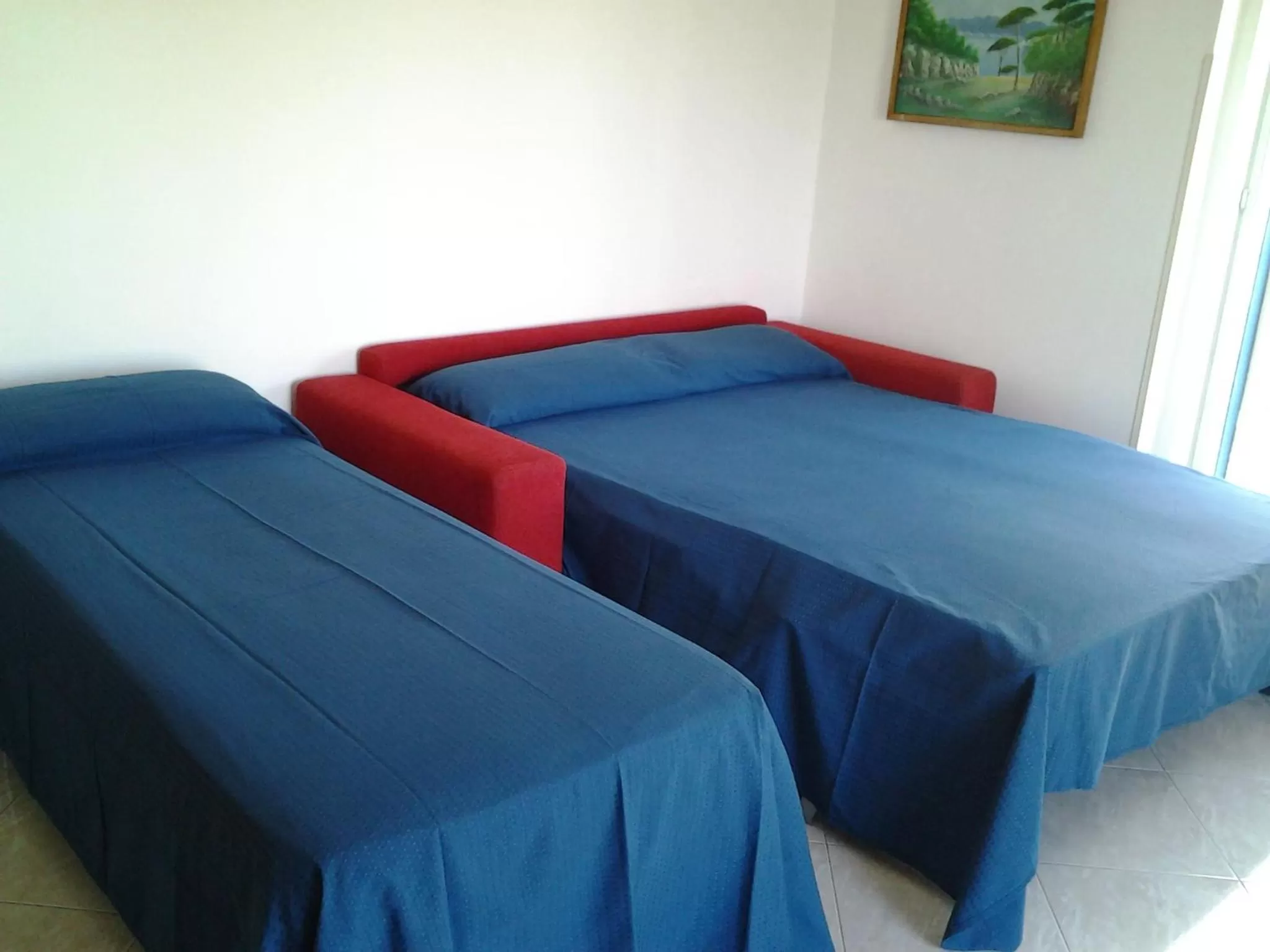 Living room, Bed in Hotel Conca d'Oro