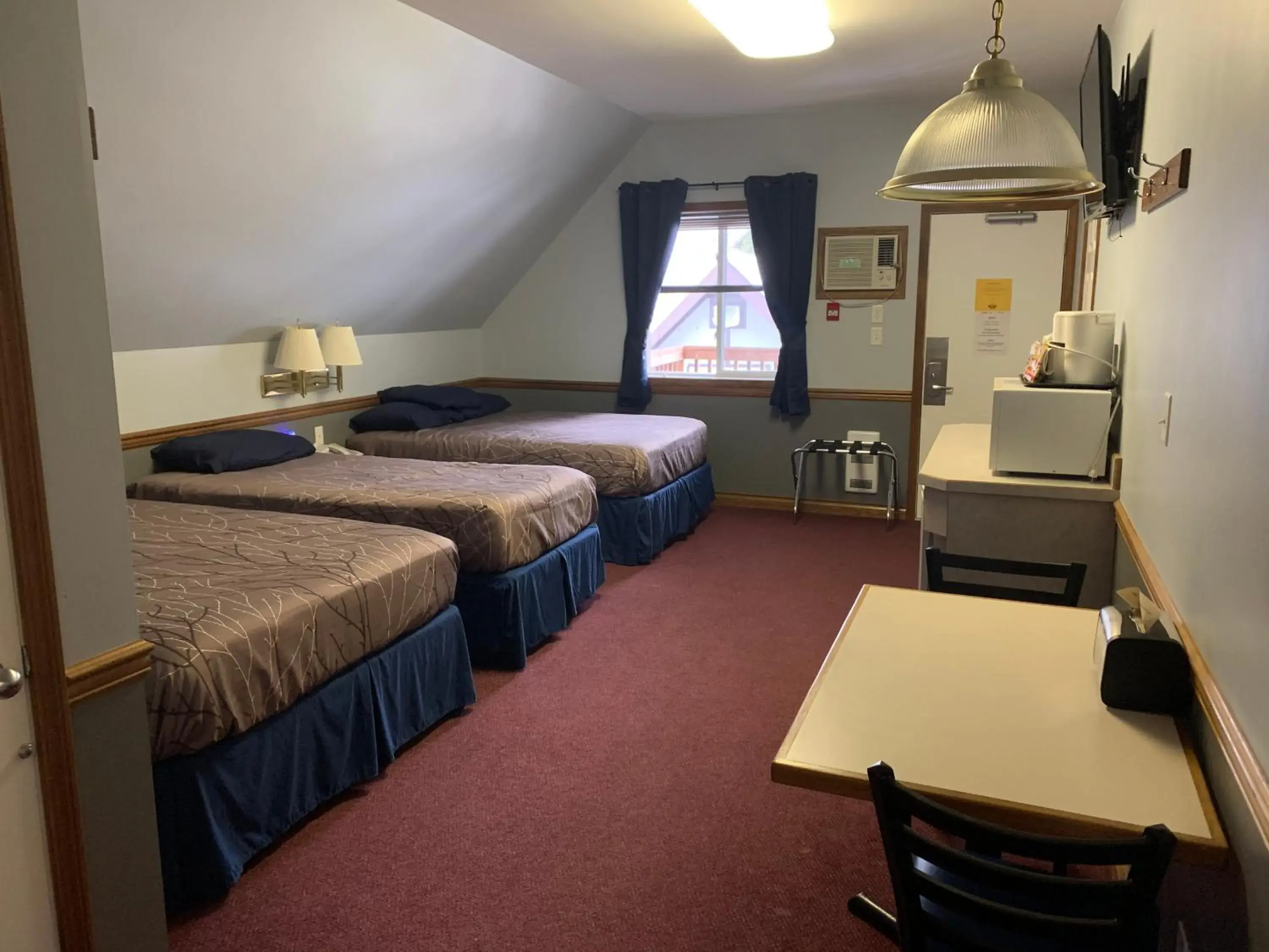 Family Suite with Two Doubles and Twin Bed in Peaks Lodge Family Suite with Two Doubles and Twin Bed in Peaks Lodge