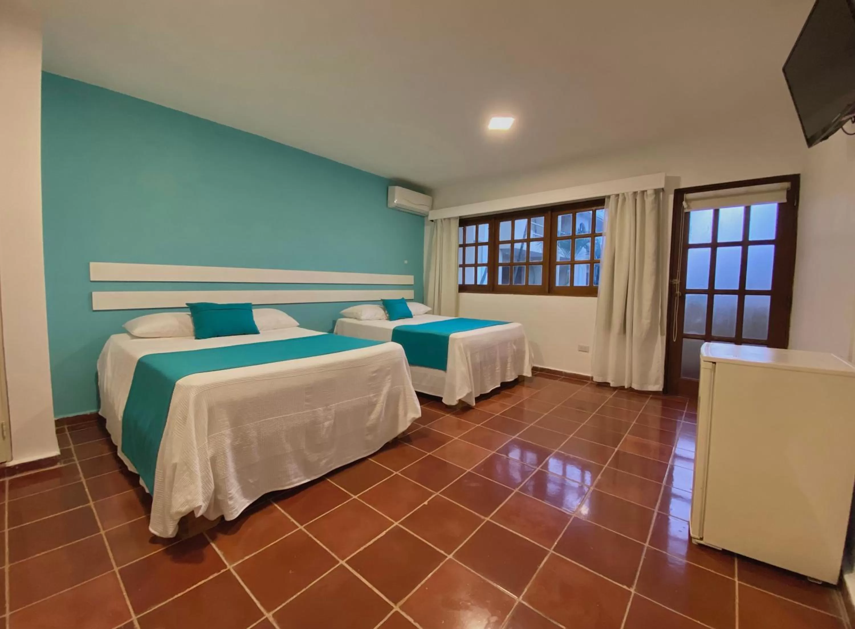 Bed in Calypso Beach Hotel by The Urbn House Santo Domingo Airport