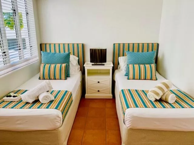 Bedroom, Bed in BeachView Apartments at Villa Paradiso