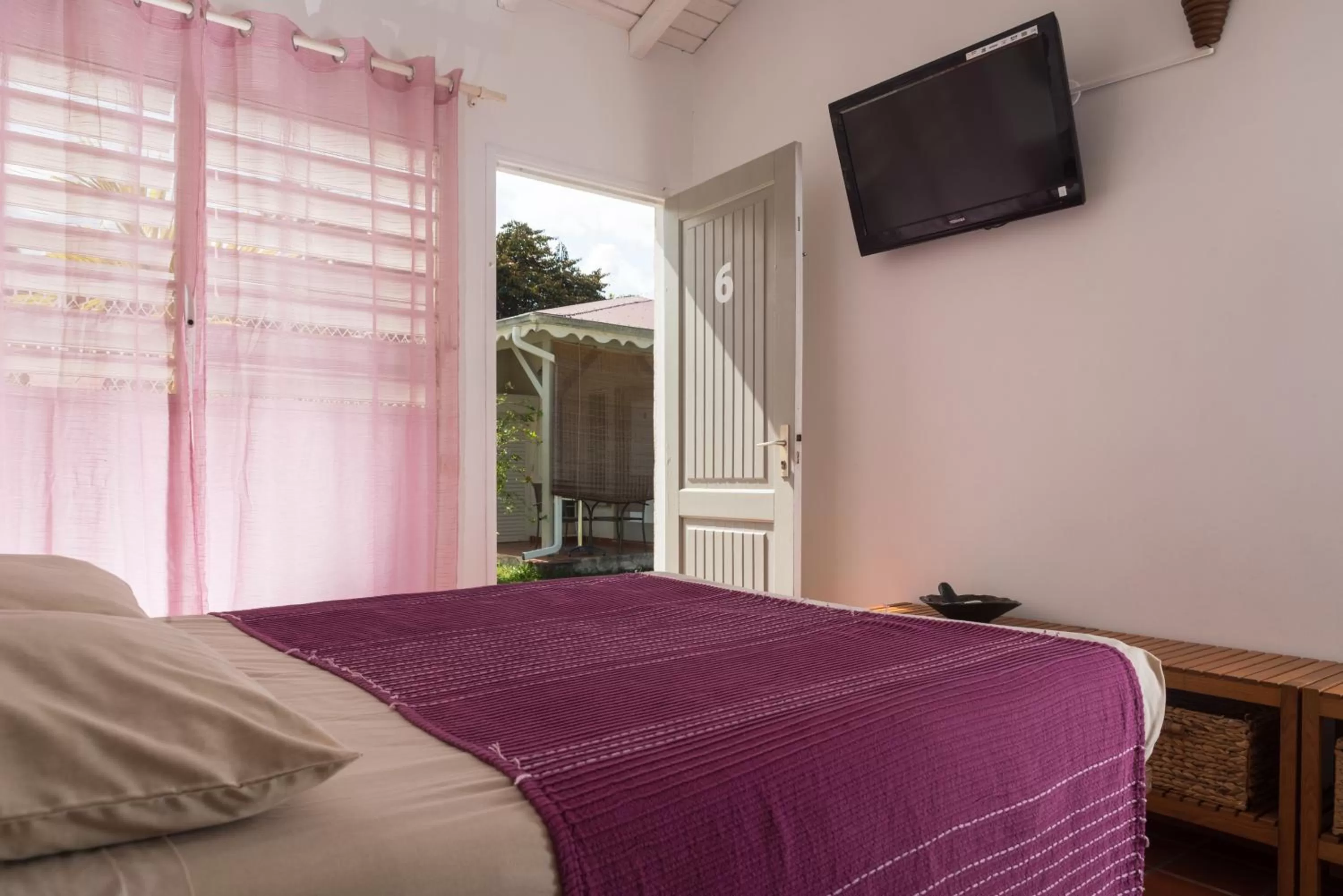 Photo of the whole room, Bed in Hôtel Les Bananiers