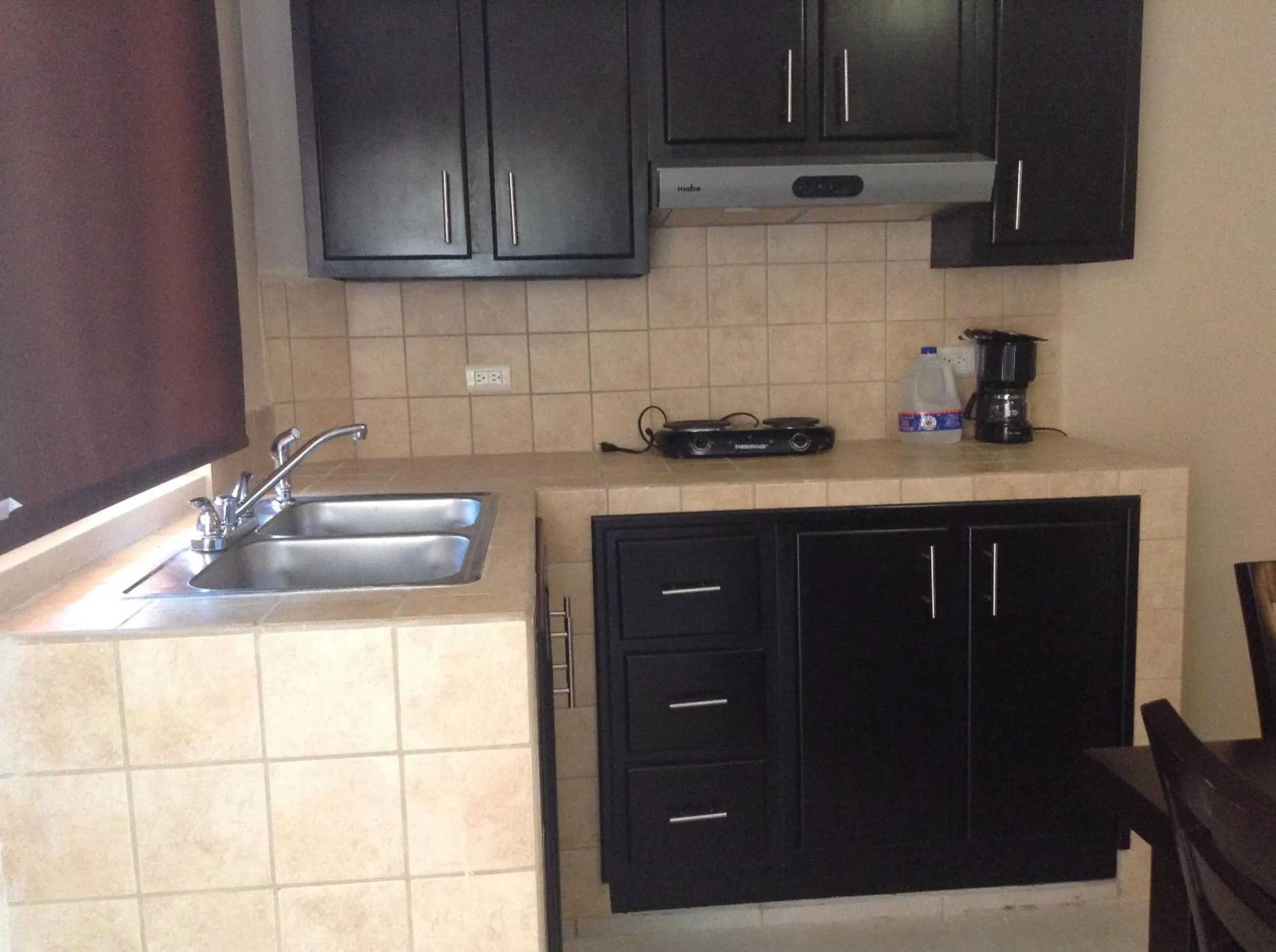 Kitchen or kitchenette in Los Jitos Hotel & Suites