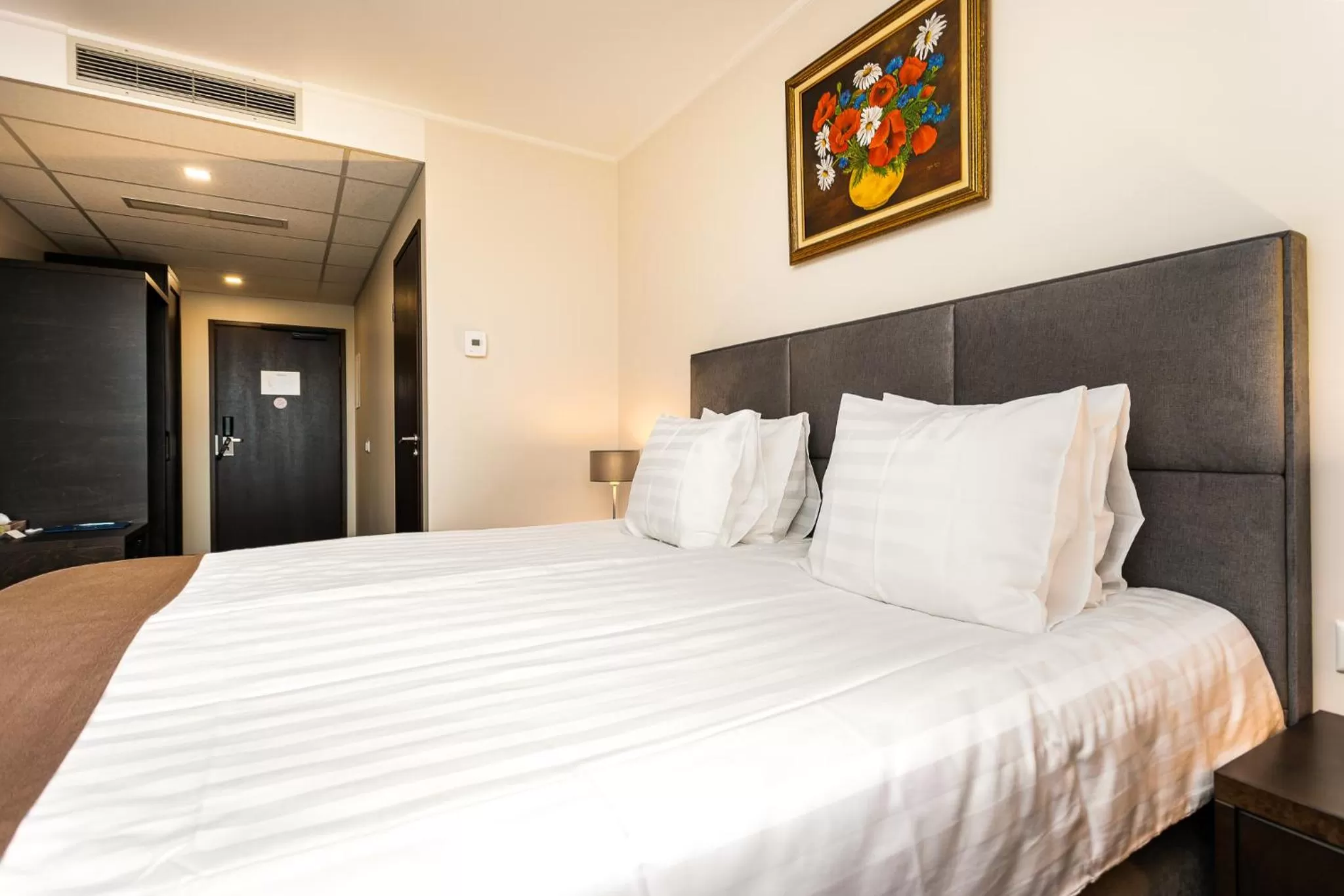 Bed in Adoryal Hotell