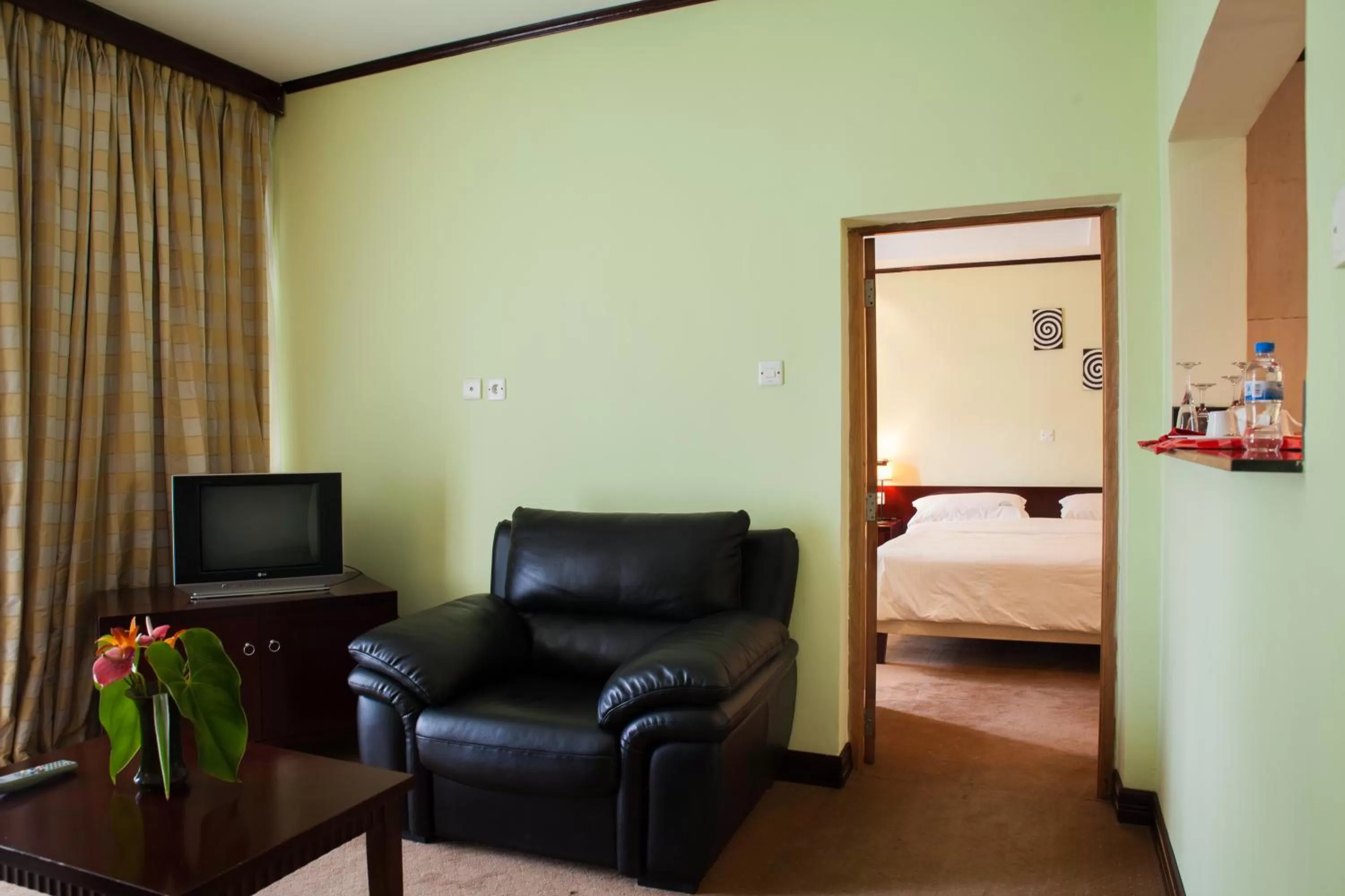 Living room, Bed in Gorillas Lake Kivu Hotel