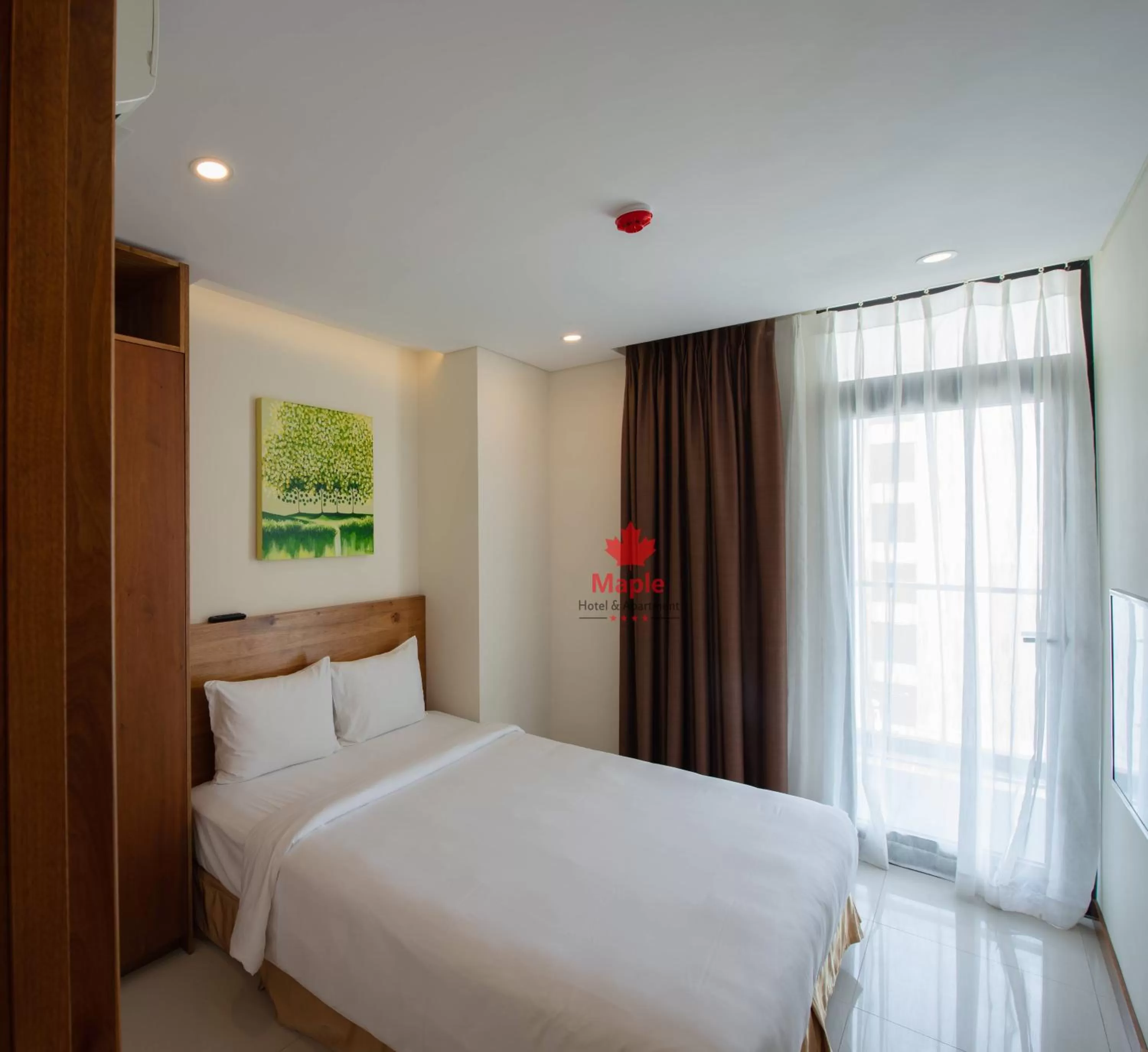 Bed in Maple Hotel & Apartment