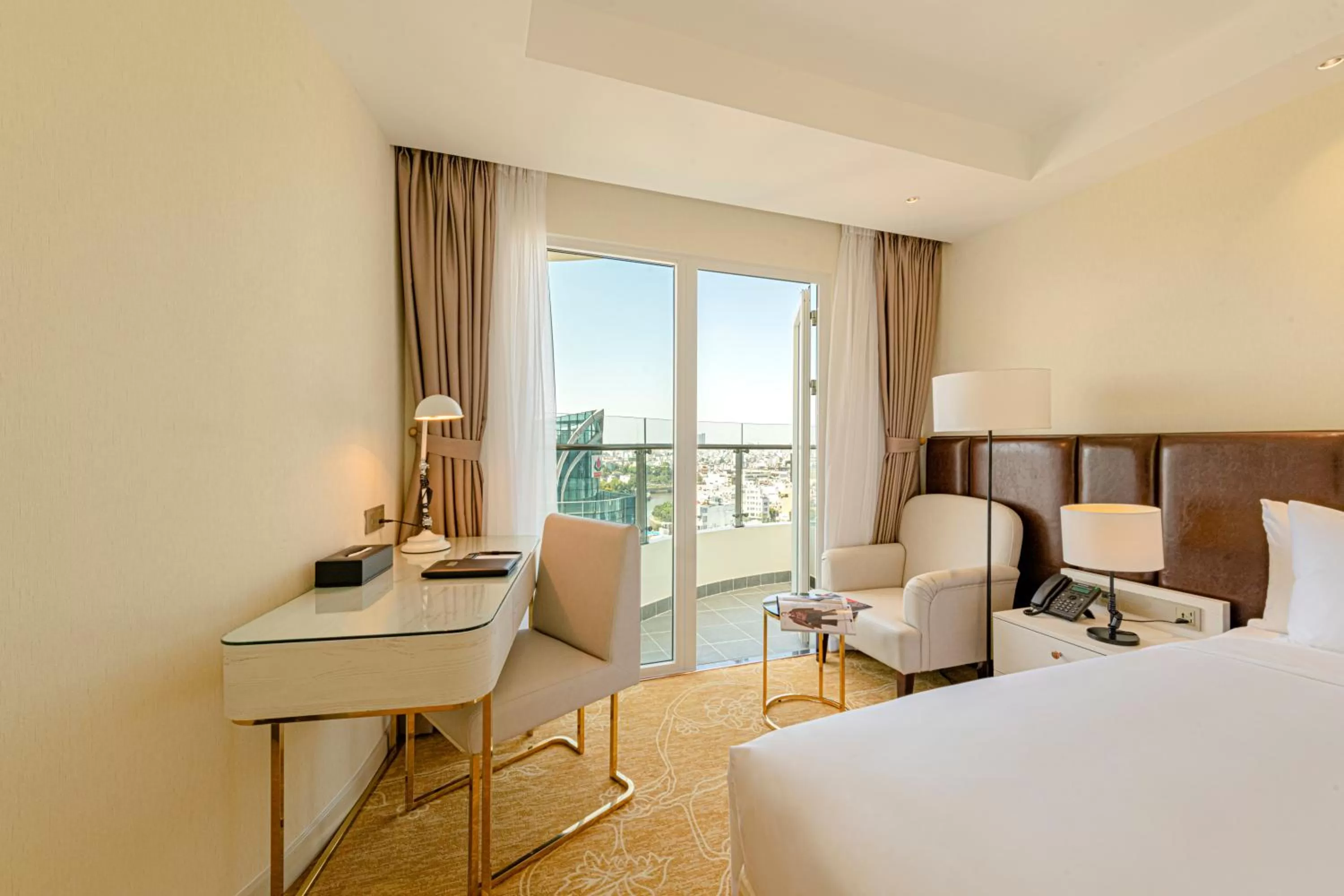 Property building, Bed in La Vela Saigon Hotel