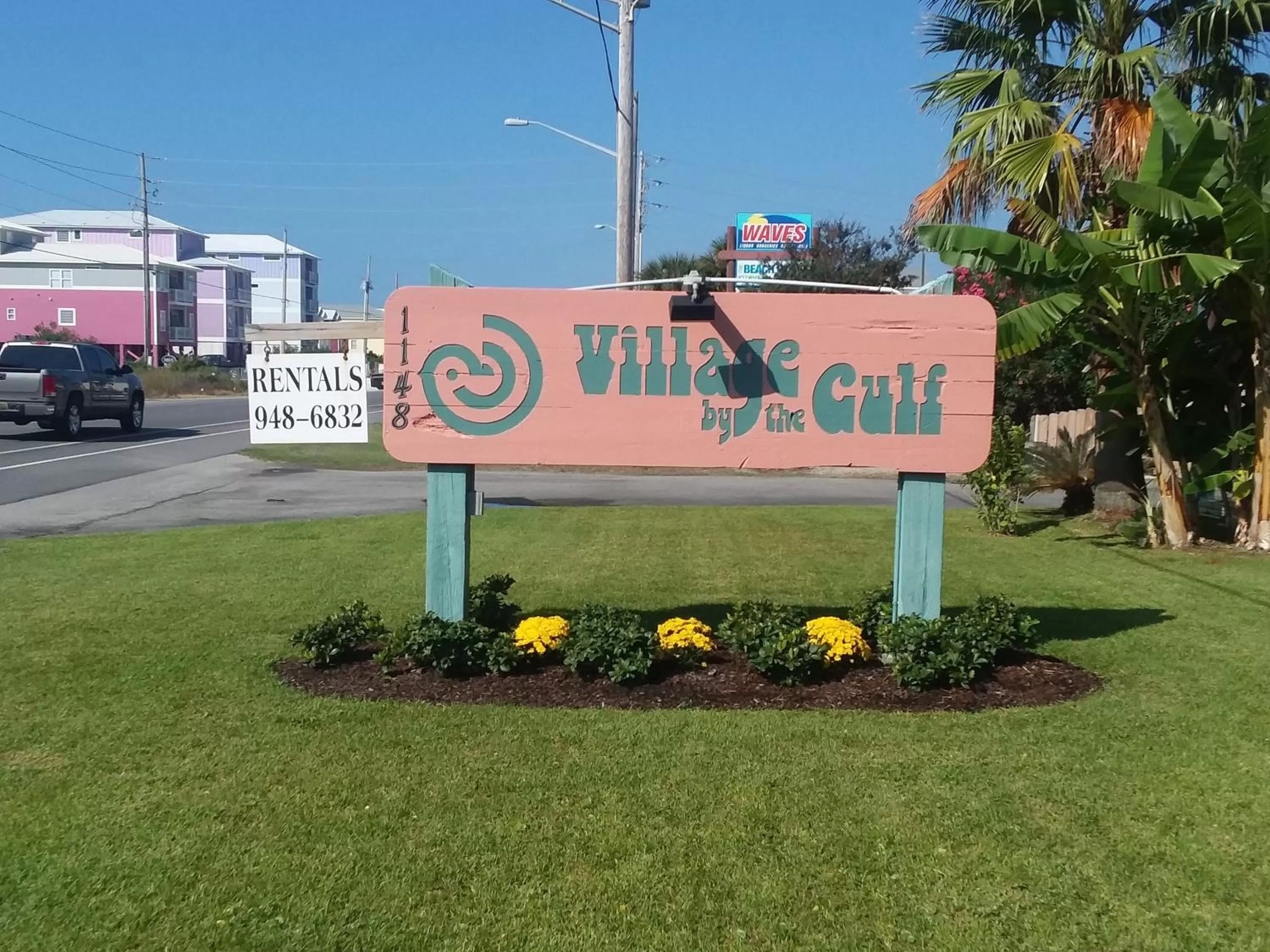 Property logo or sign in Village by the Gulf