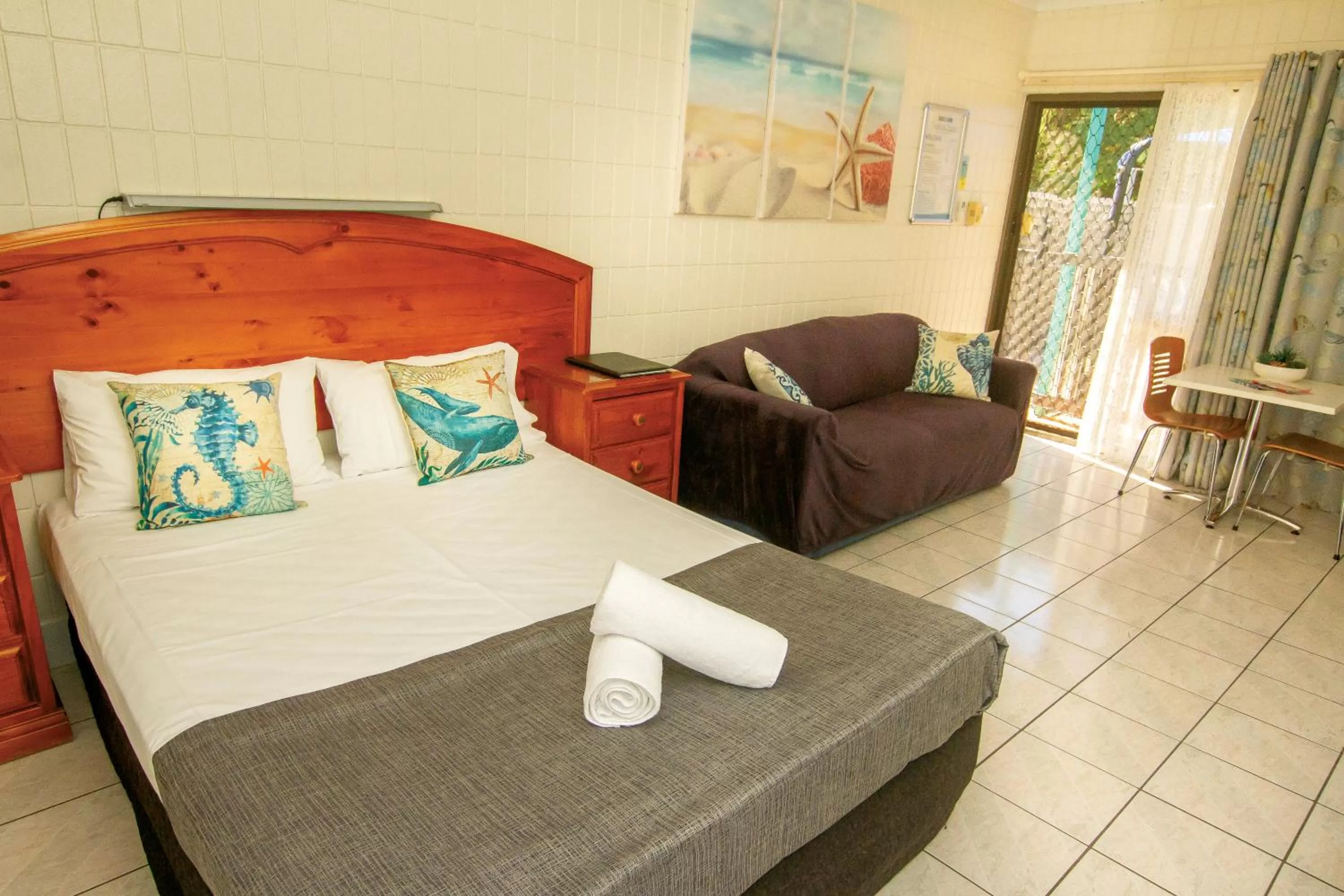 Bed in Tropical Palms Resort & 4WD Hire
