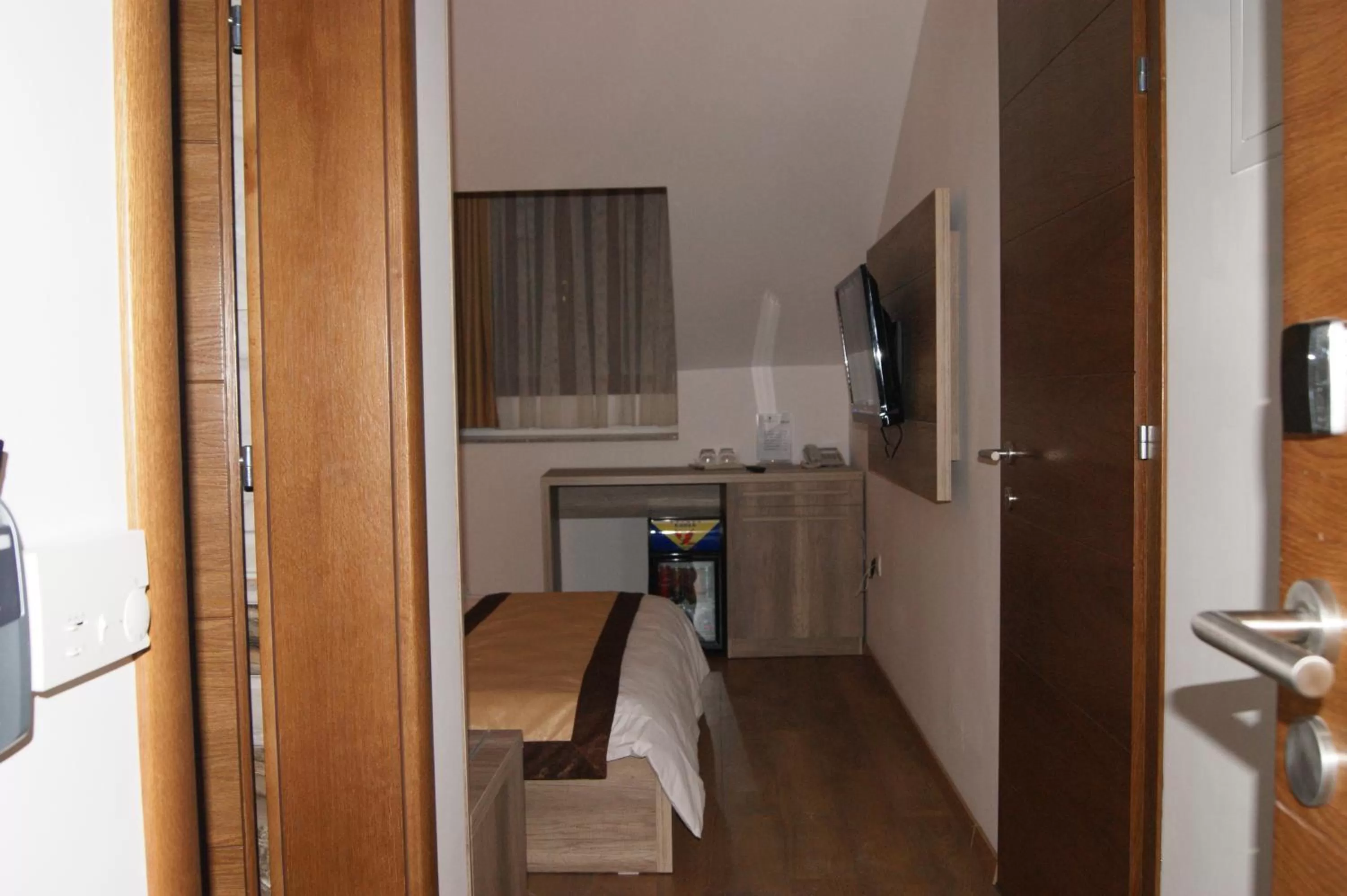 Bedroom, Dining Area in Hotel Prizreni