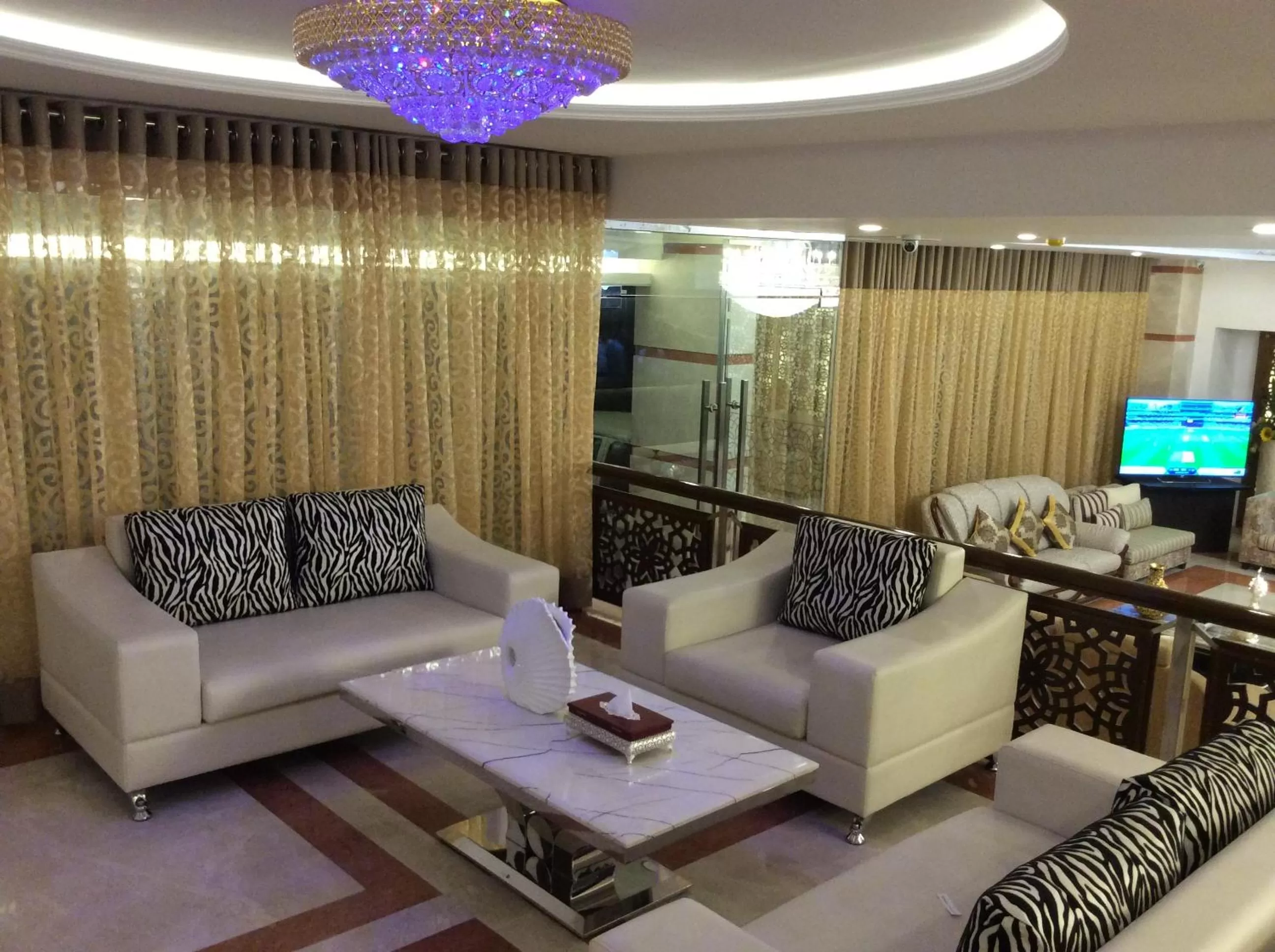 Communal lounge/ TV room in Marino Royal Hotel