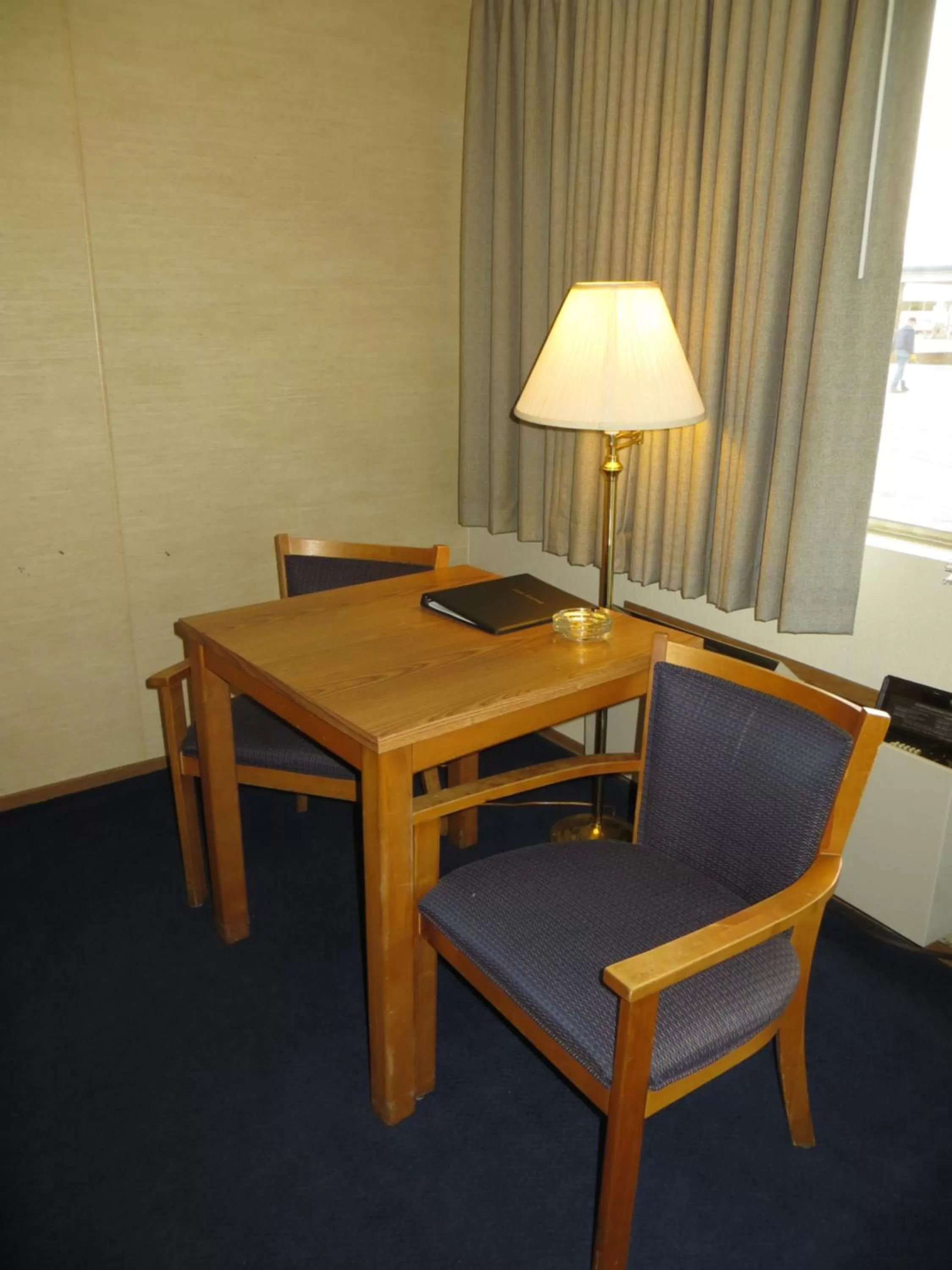 Seating area in Super 8 by Wyndham Susanville