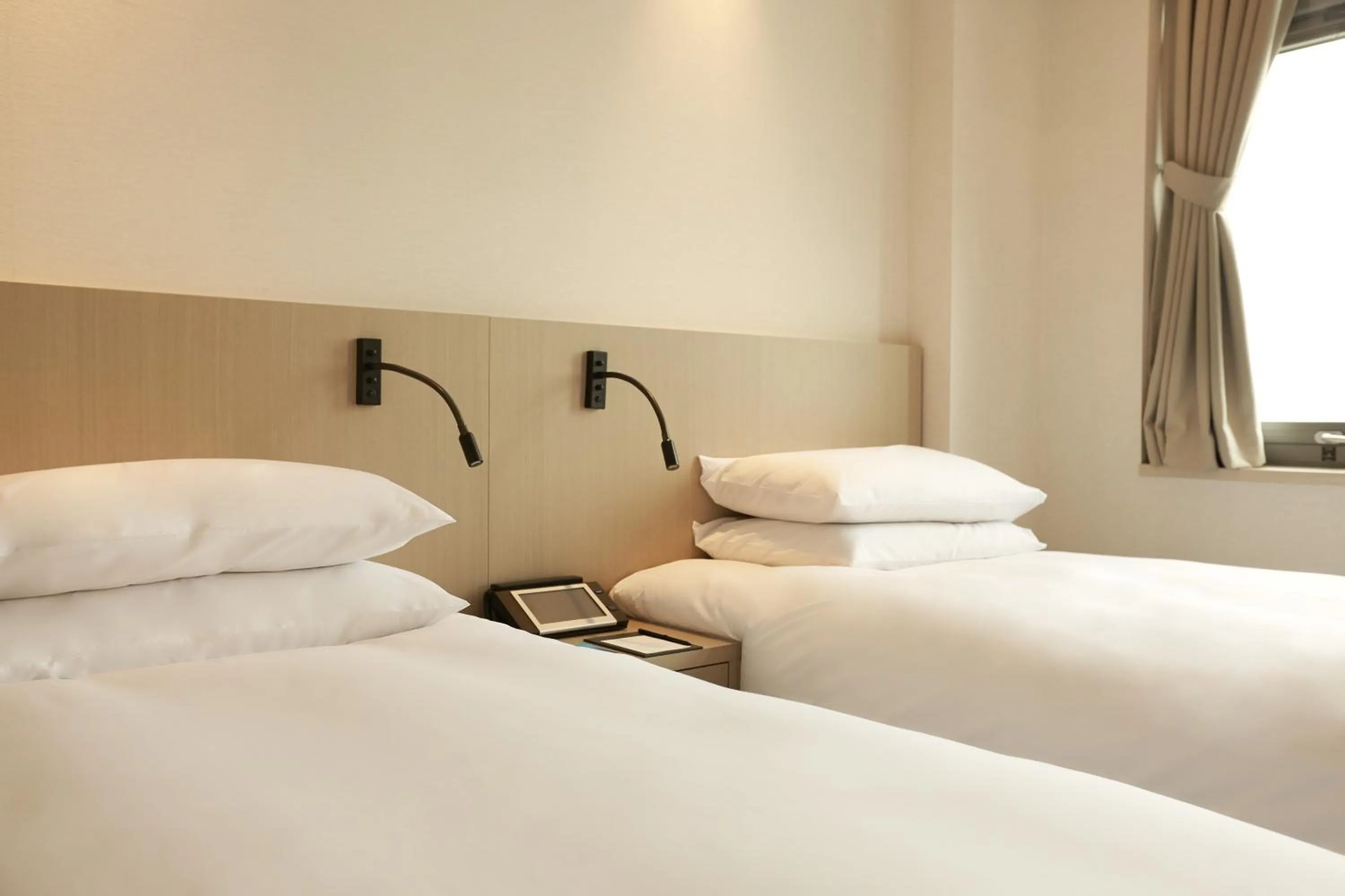 Bed in Mayplace Hotel