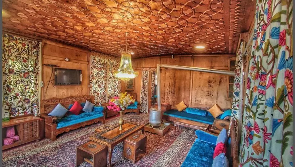 Bed, Seating Area in Nazneen Group Of Houseboats