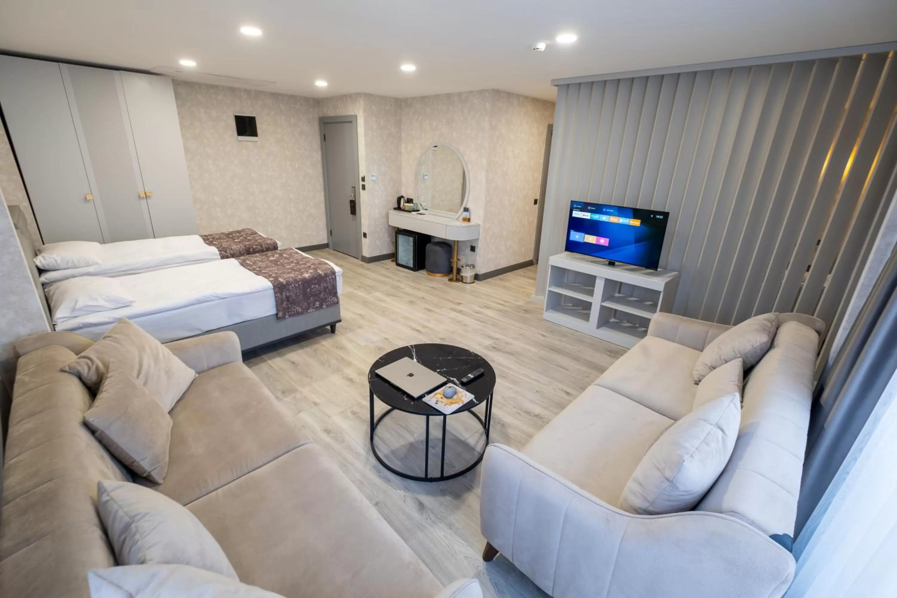 Bed, Seating Area in Avion Suite Hotel