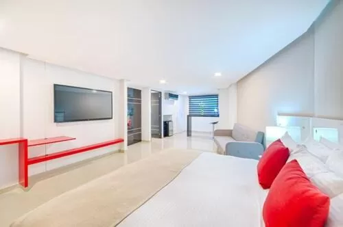 Bedroom, TV/Entertainment Center in Hotel Blue 66