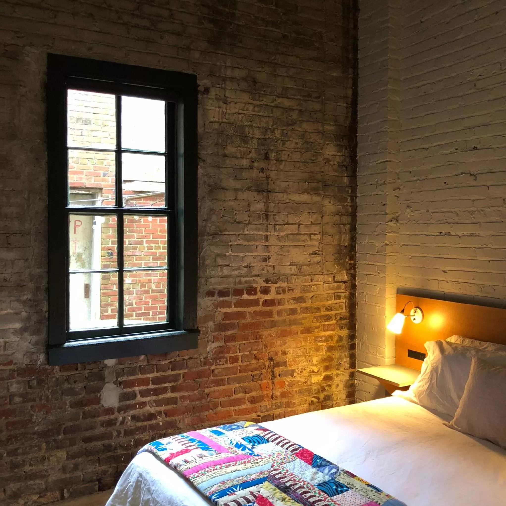 Bed in Travelers Hotel