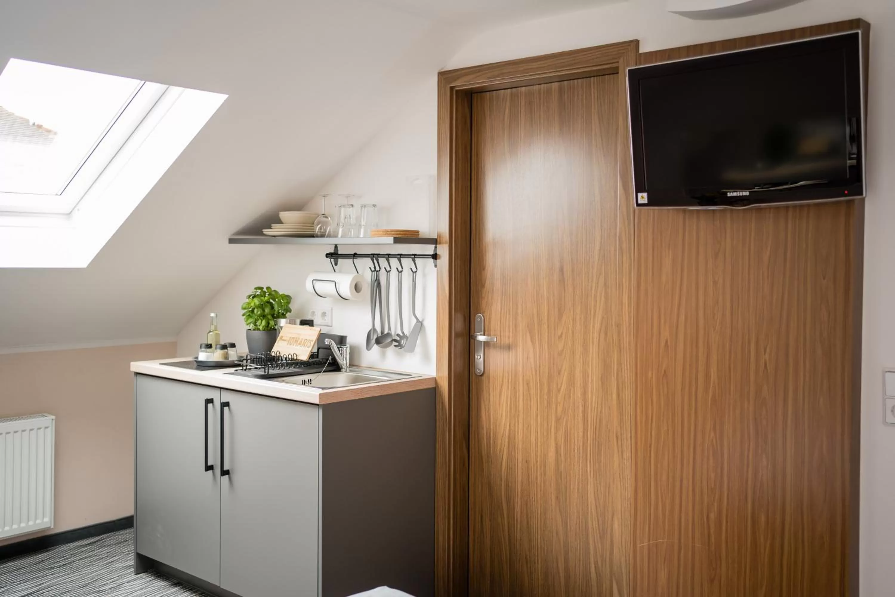 TV and multimedia, TV/Entertainment Center in Point Hotel Apartments and Rooms