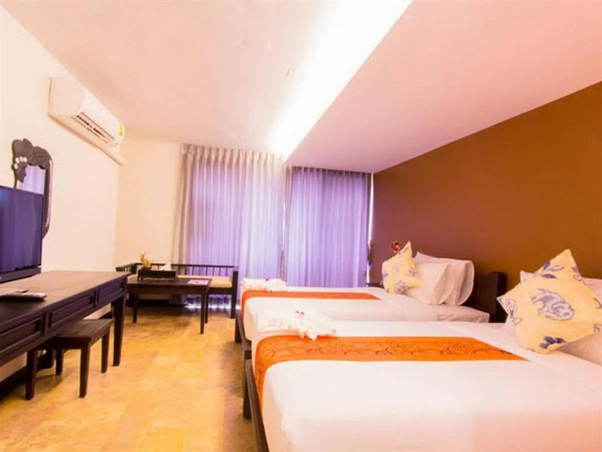 Bed in All Together Suite Hotel