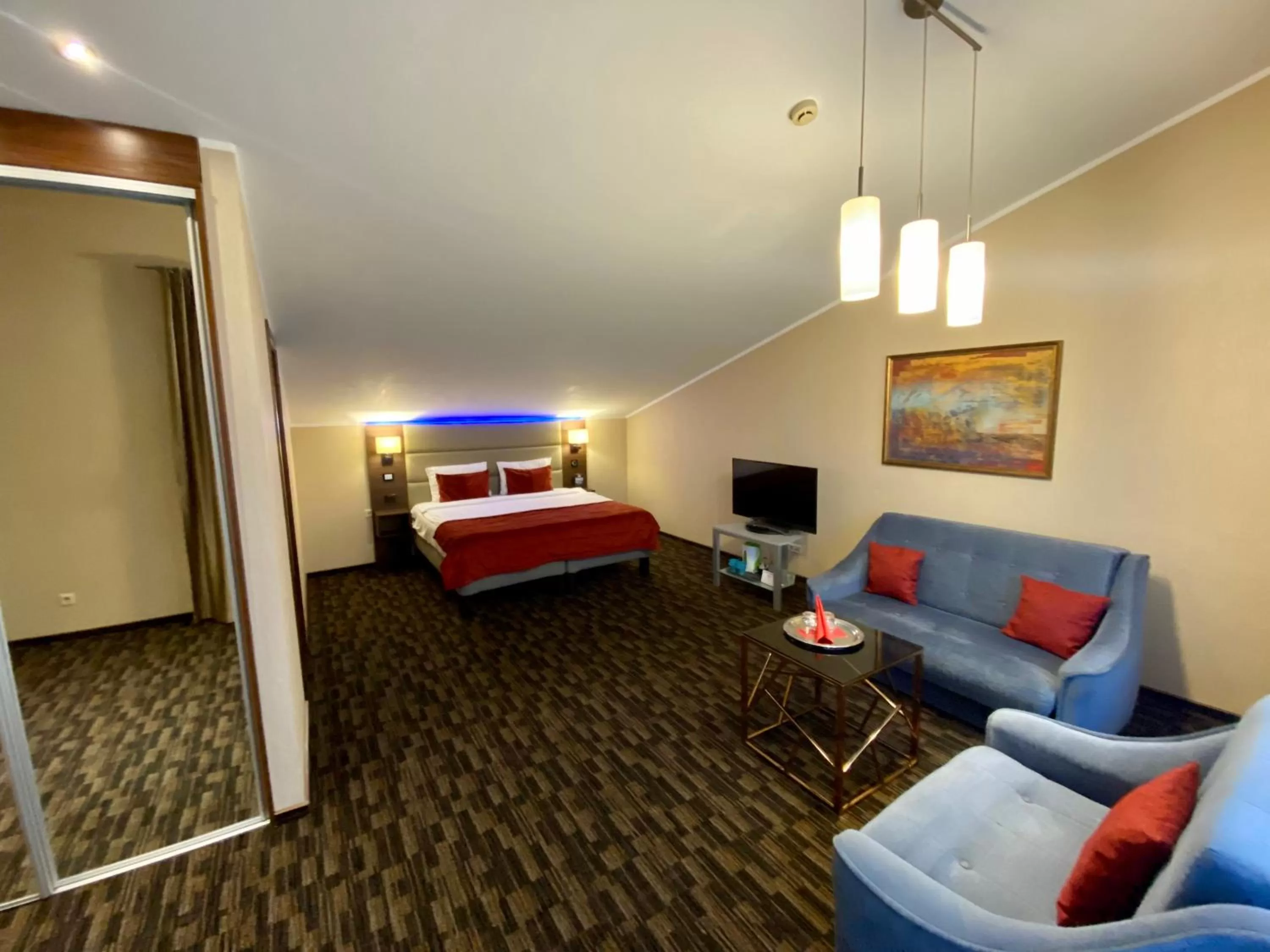 Bedroom, Seating Area in Olympus Hotel