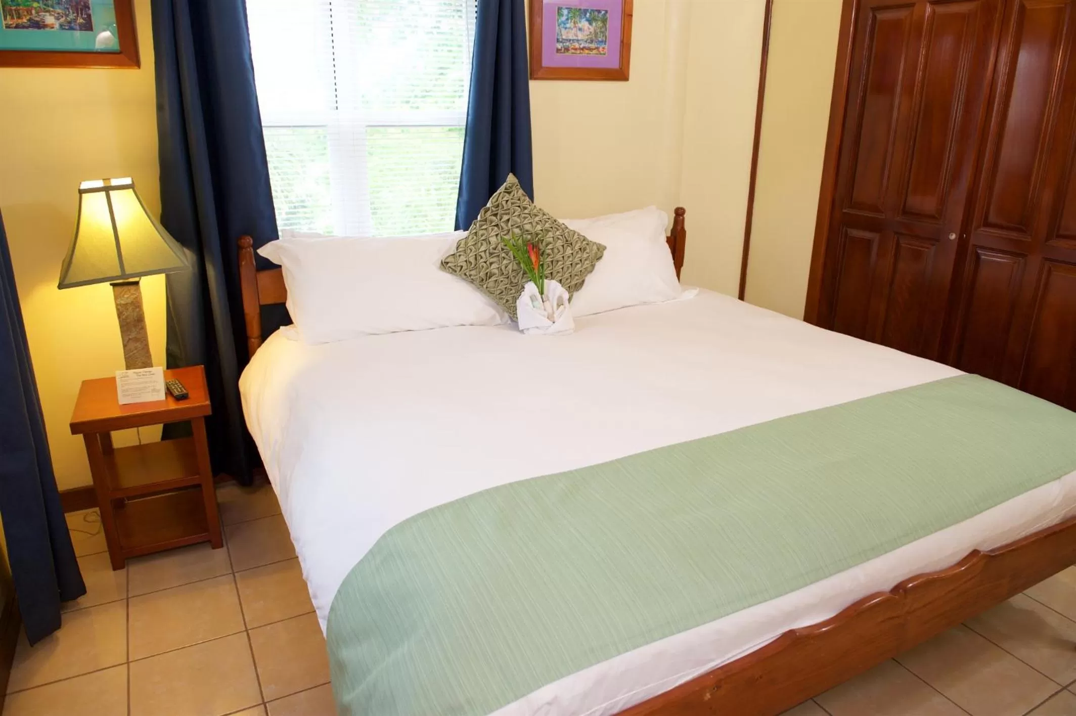 Bed in The Palms Oceanfront Suites