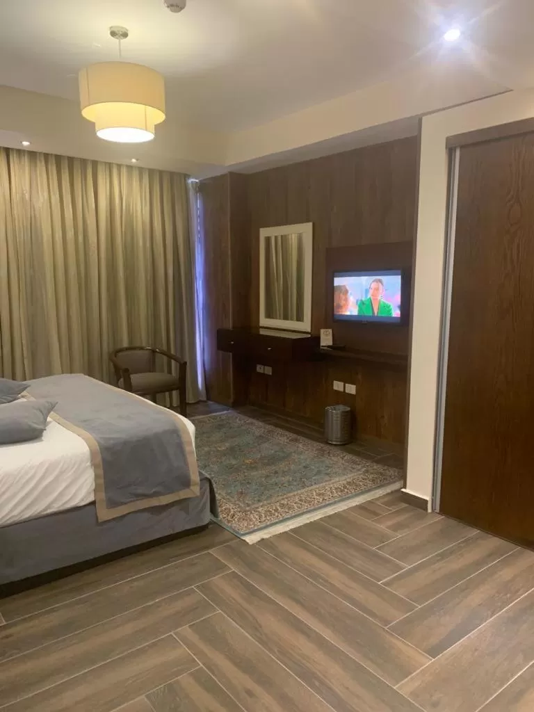 Bed in City Rose Hotel Suites