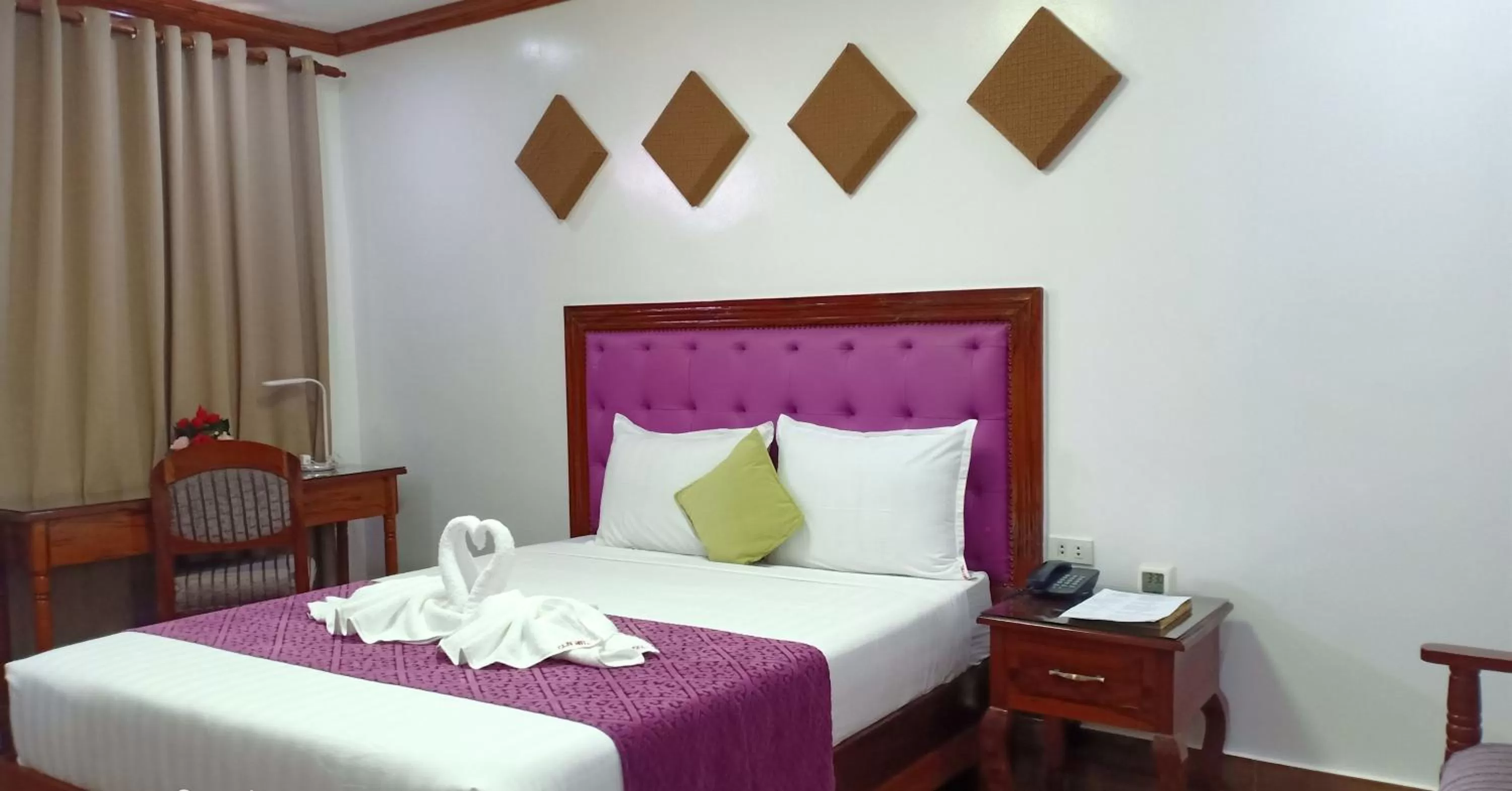 Bed in CLN Boutique Hotel