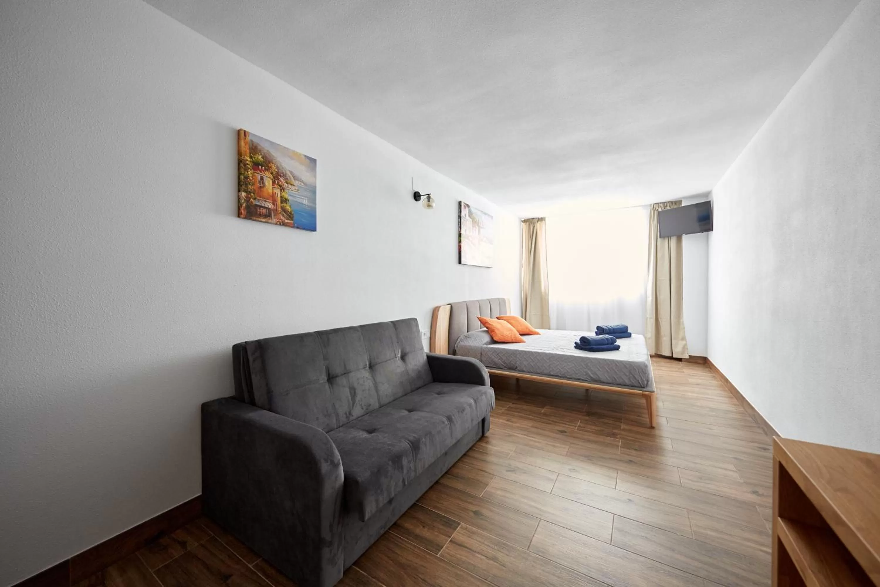 Seating area, Bed in El Patio Hostal